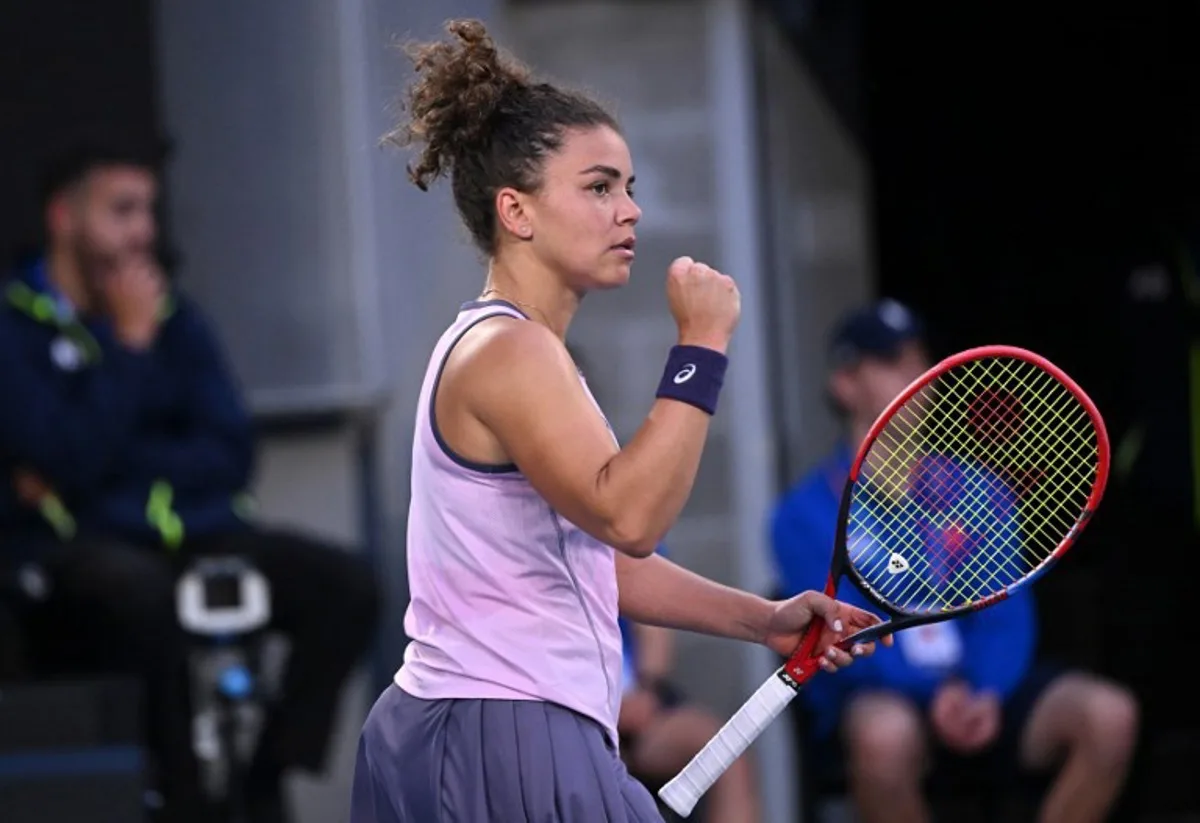 Italy's Jasmine Paolini reacts after a point against China's Wei Sijia during their women's singles match on day three of the Australian Open tennis tournament in Melbourne on January 14, 2025.  WILLIAM WEST / AFP