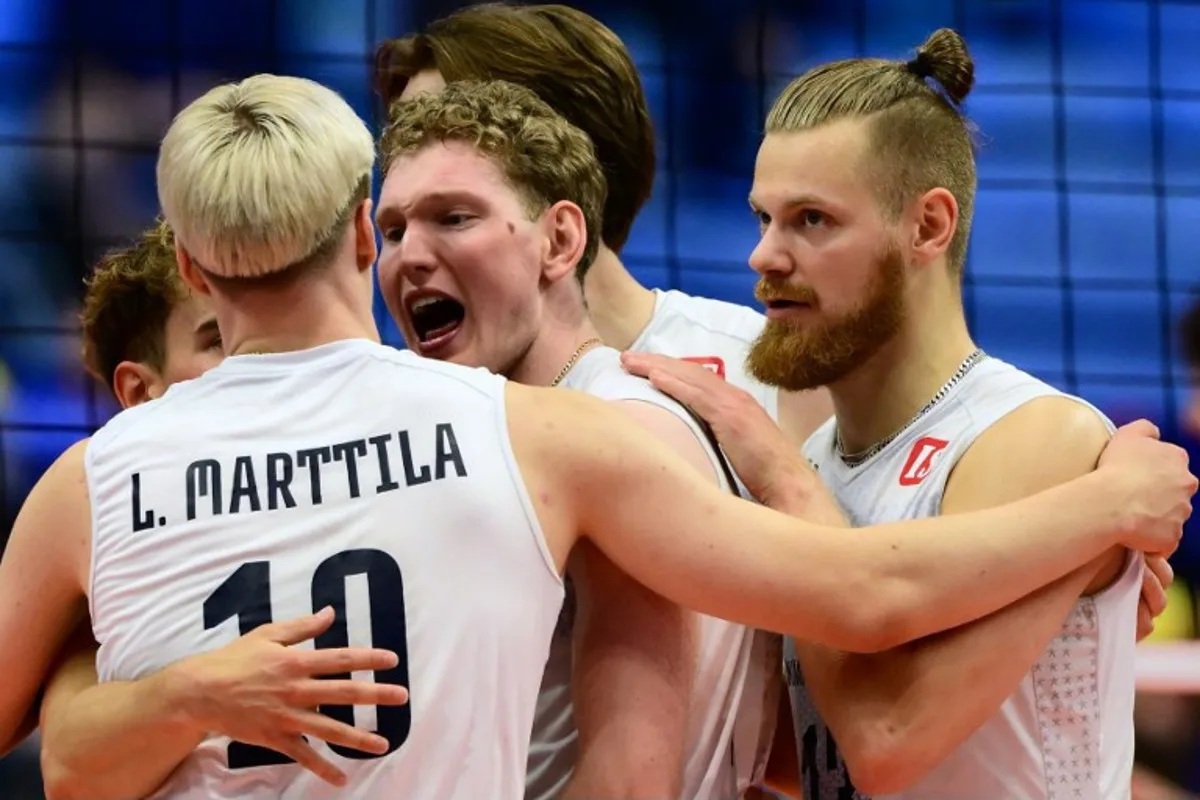 Finland's Fedor Ivanov (C) celebrates after scoring during the CEV EuroVolley 2026 men's quarterfinal volleyball match between Italy and Finland at the Palavela in Turin on September 23, 2026.  Marco BERTORELLO / AFP