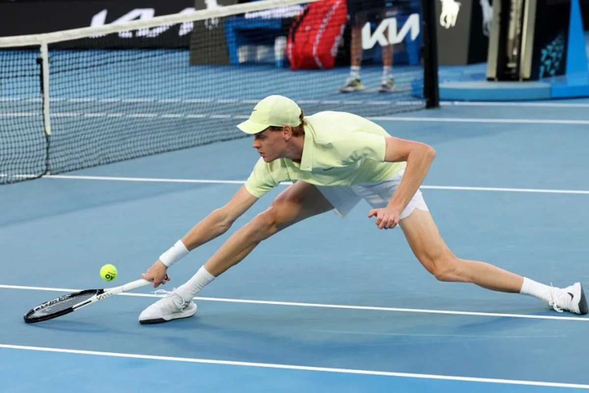 Italy's Jannik Sinner hits a return against Australia's Tristan Schoolkate during their men's singles match on day five of the Australian Open tennis tournament in Melbourne on January 16, 2025.  DAVID GRAY / AFP