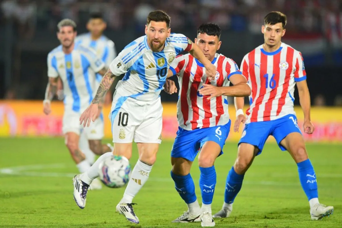 Argentina's forward #10 Lionel Messi and Paraguay's defender #06 Junior Alonso fight for the ball next to Paraguay's midfielder #16 Damian Bobadilla during the 2026 FIFA World Cup South American qualifiers football match between Paraguay and Argentina at the Ueno Defensores del Chaco stadium in Asuncion on November 14, 2024.  Daniel Duarte / AFP