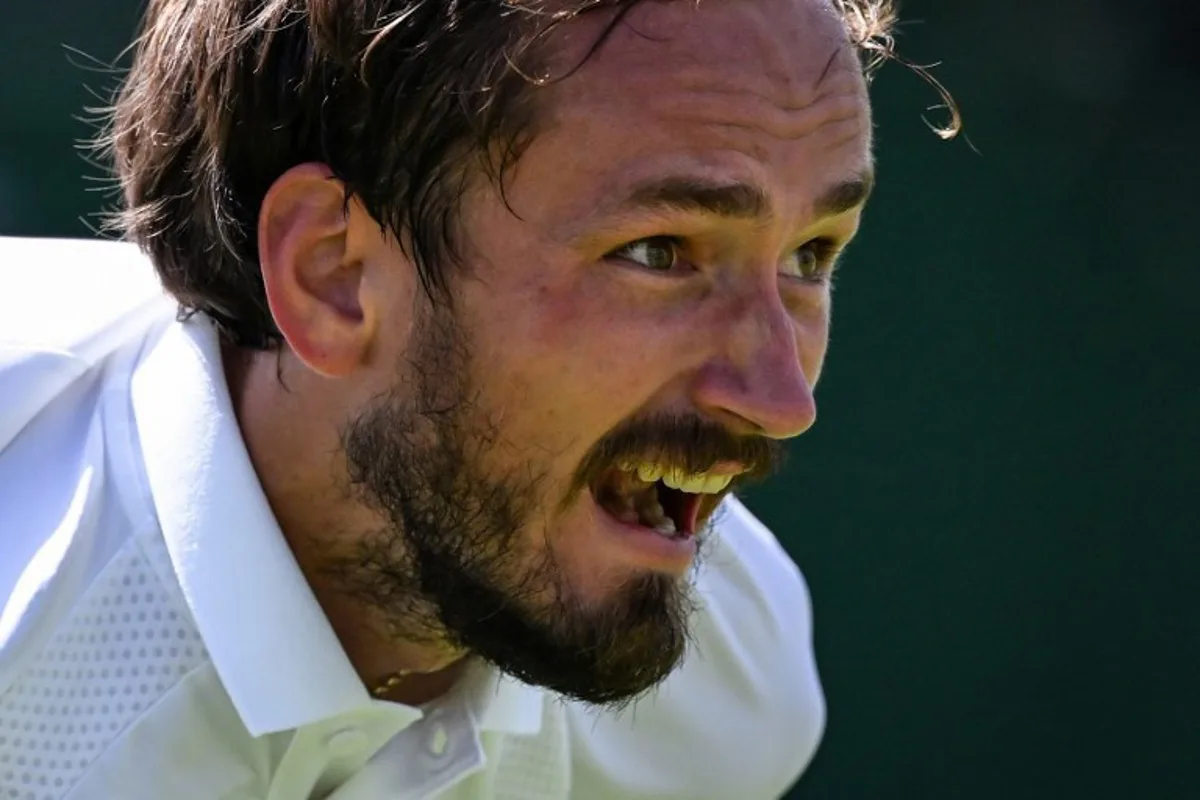 Russia's Daniil Medvedev reacts as he plays against France's Benjamin Bonzi during their men's singles first round tennis match on the first day of the 2025 Wimbledon Championships at The All England Lawn Tennis and Croquet Club in Wimbledon, southwest London, on June 30, 2025. Kirill KUDRYAVTSEV / AFP