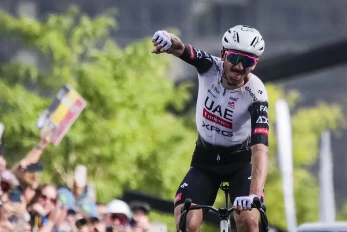 American Brandon McNulty, of UAE Team Emirates XRG, crosses the finish line during the 14th Grand Prix Cycliste de Montreal cycling road race in Montreal, Canada, on September 14, 2025. MATHIEU BELANGER / AFP