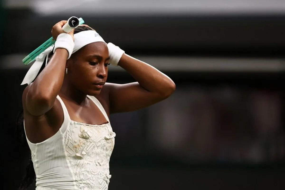 US player Coco Gauff reacts as she plays against Ukraine's Dayana Yastremska during their women's singles first round tennis match on the second day of the 2025 Wimbledon Championships at The All England Lawn Tennis and Croquet Club in Wimbledon, southwest London, on July 1, 2025. HENRY NICHOLLS / AFP