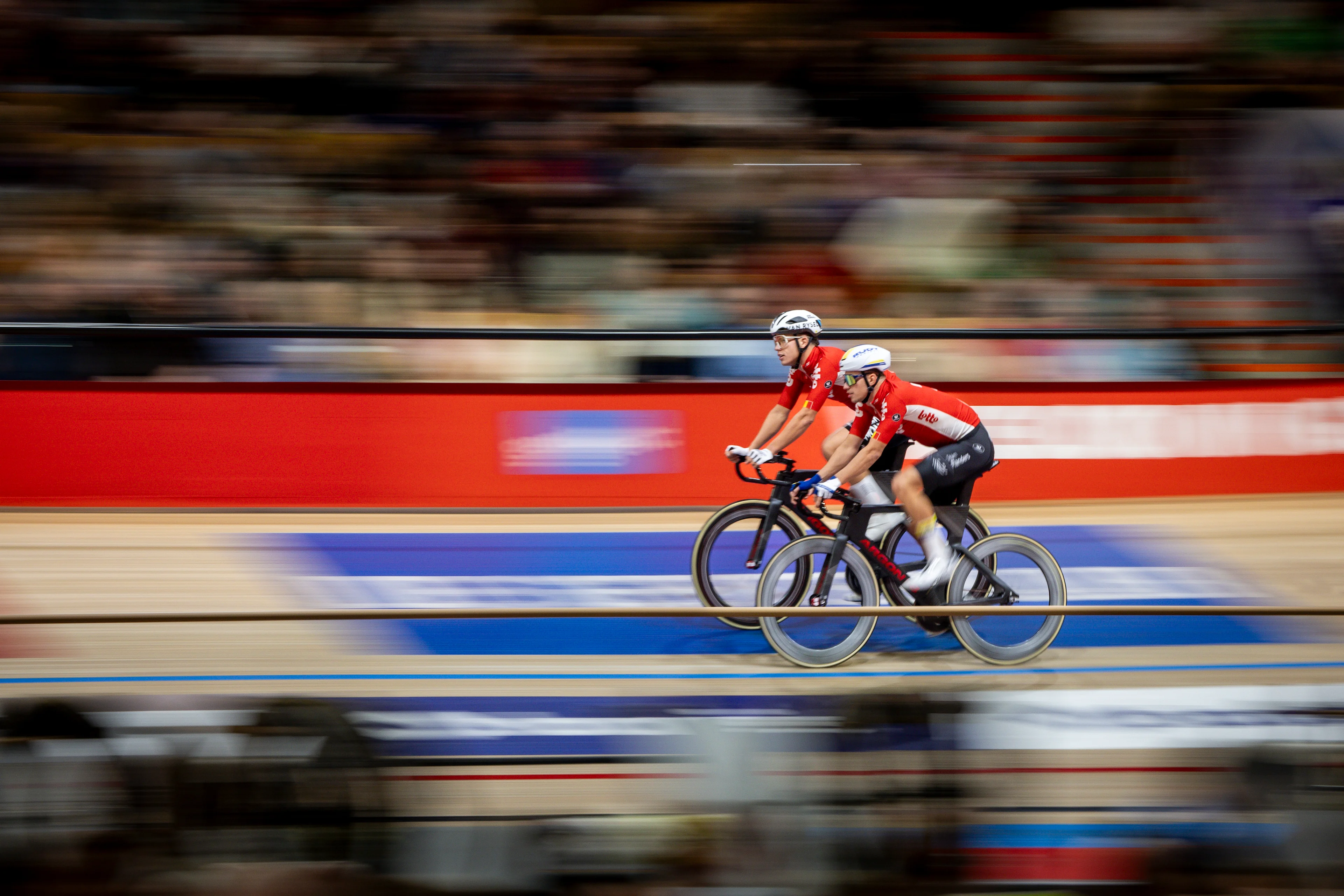 Belgian Noah Vandenbranden and Belgian Gianluca Pollefliet pictured in action during day four of the Zesdaagse Vlaanderen-Gent six-day indoor track cycling event at the indoor cycling arena 't Kuipke, Friday 15 November 2024, in Gent. BELGA PHOTO DAVID PINTENS