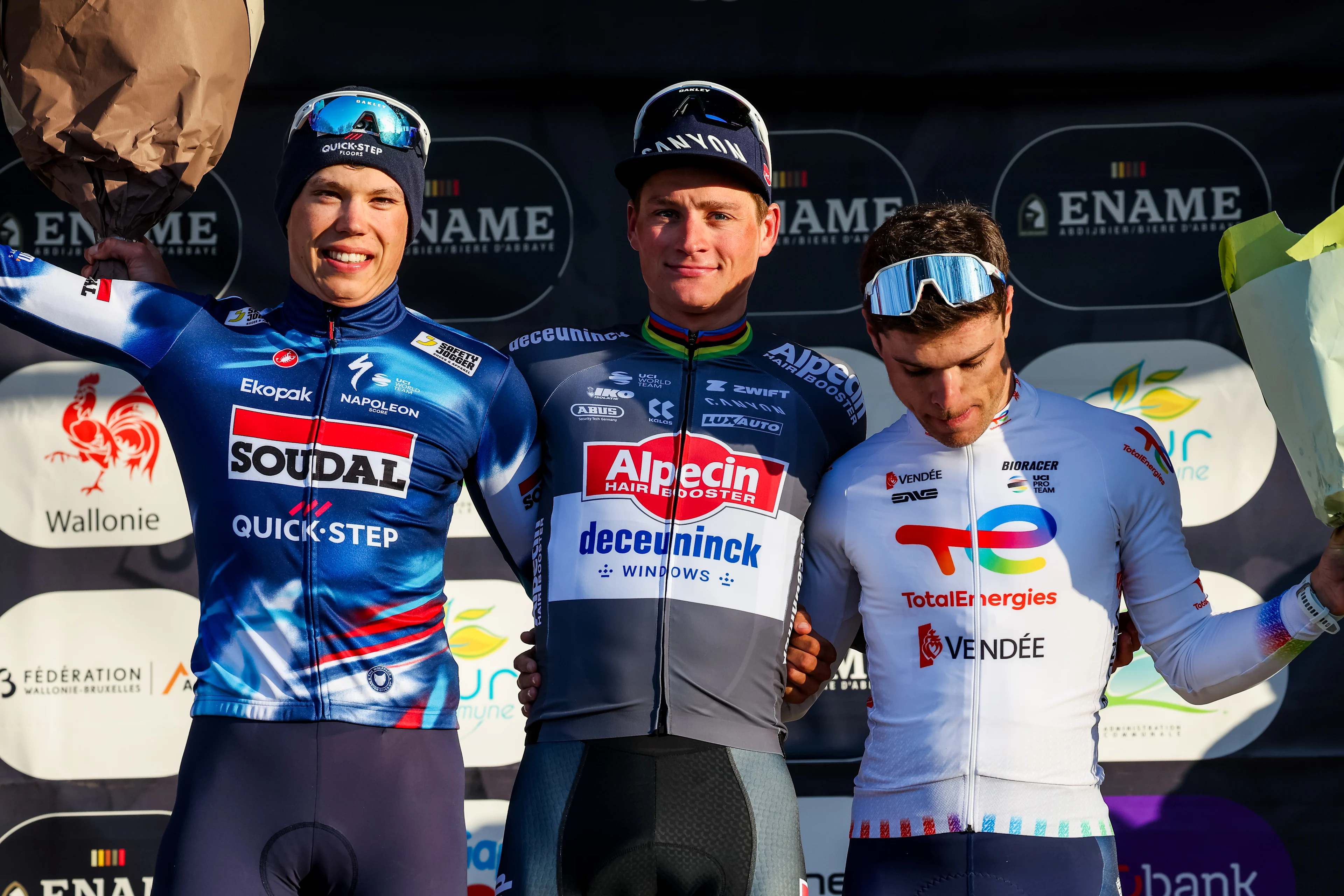 French Paul Magnier of Soudal Quick-Step, Dutch Mathieu van der Poel of Alpecin-Deceuninck and French Emilien Jeanniere of TotalEnergies pictured on the podium after the 'Ename Samyn Classic' one day cycling race, 199,1km from Quaregnon to Dour on Tuesday 04 March 2025. BELGA PHOTO VIRGINIE LEFOUR