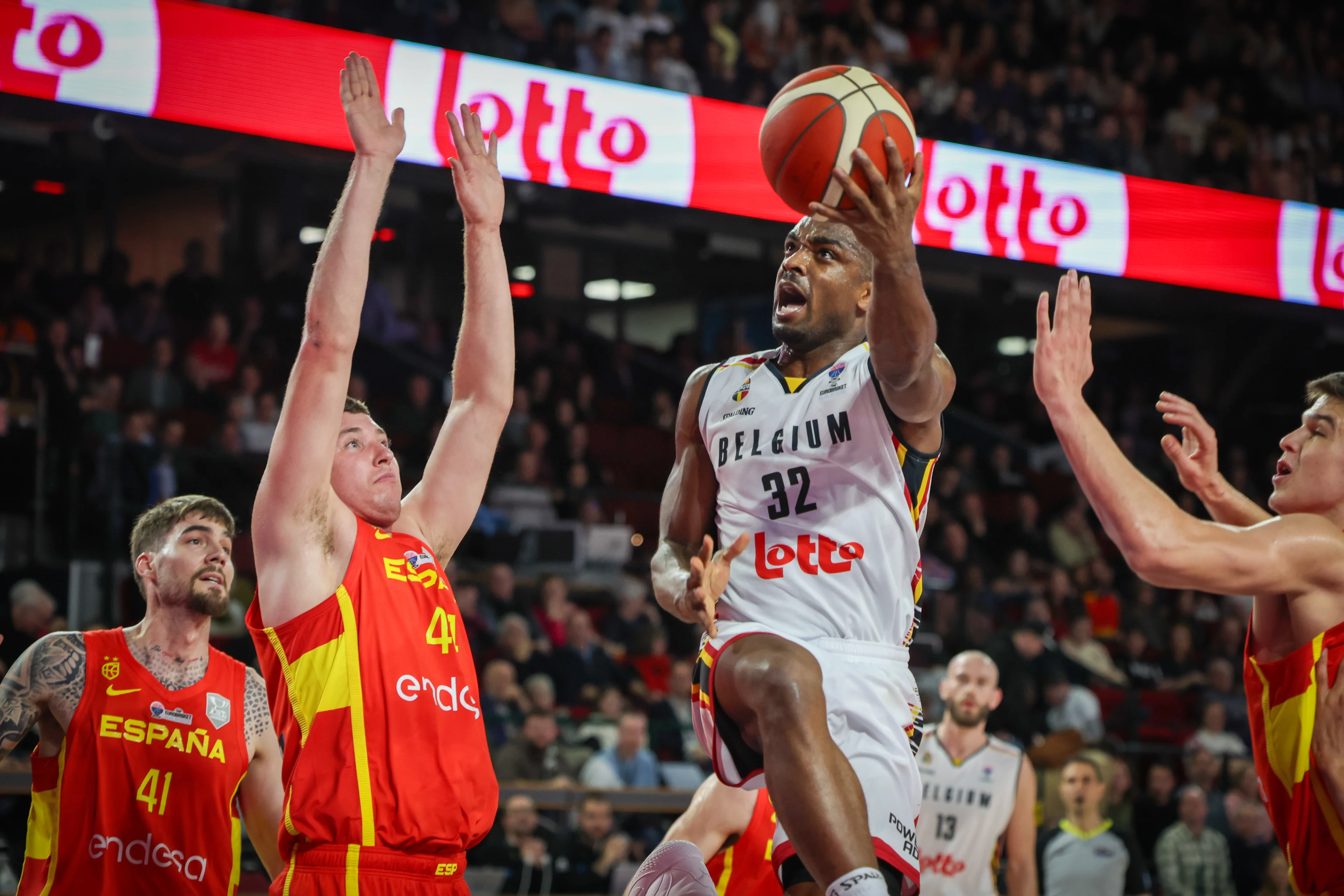 Spain's Joel Parra and Belgium's Retin Obasohan fight for the ball during a basketball match between Belgium's national team Belgian Lions and Spain, Sunday 25 February 2024 in Charleroi, game 2/6 in the group stage for the Euro 2025 qualifications. BELGA PHOTO VIRGINIE LEFOUR