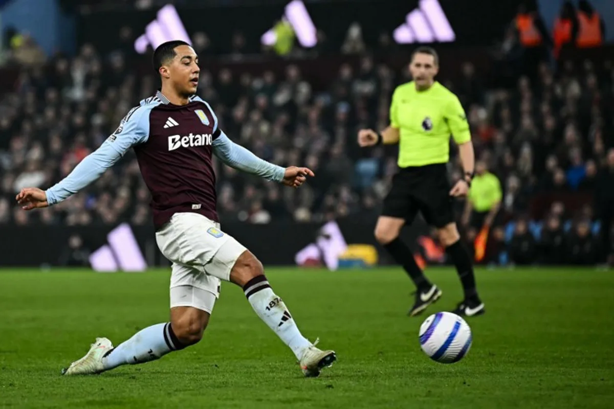 Aston Villa's Belgian midfielder #08 Youri Tielemans shoots the ball during the English Premier League football match between Aston Villa and Liverpool at Villa Park in Birmingham, central England on February 19, 2025.  Paul ELLIS / AFP