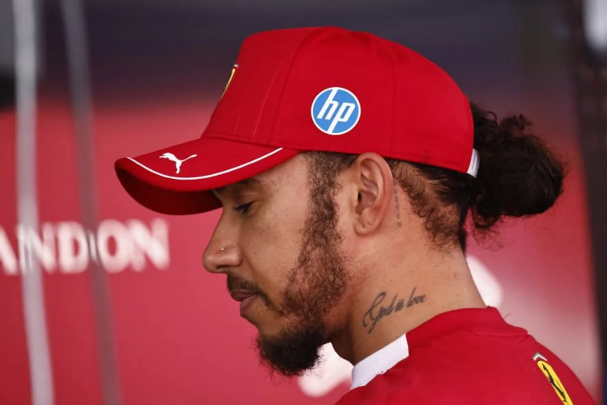 Ferrari's British driver Lewis Hamilton looks on after the Sprint Race of the Formula One Belgian Grand Prix at the Spa-Francorchamps circuit in Spa, on July 26, 2025. SIMON WOHLFAHRT / AFP