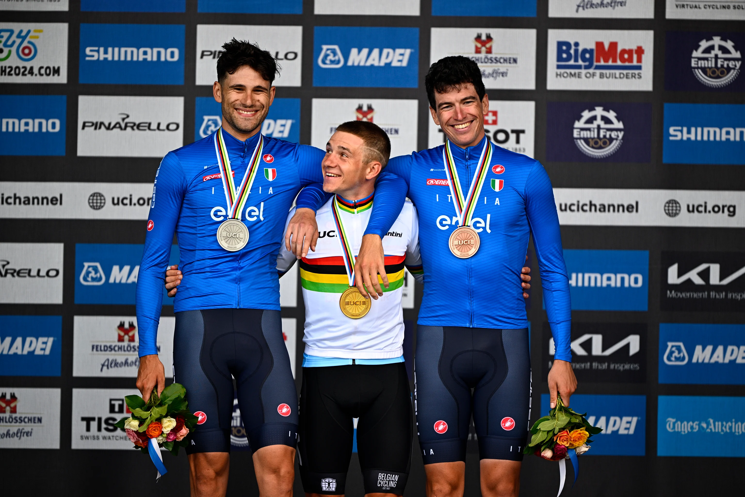 L-R, Silver medalist Italian Filippo Ganna, world champion Belgian Remco Evenepoel and bronze medalist Italian Edoardo Affini celebrate on the podium of the men elite individual time trial race at the 2024 UCI Road and Para-Cycling Road World Championships, Sunday 22 September 2024, in Zurich, Switzerland. The Worlds are taking place from 21 to 29 September. BELGA PHOTO JASPER JACOBS