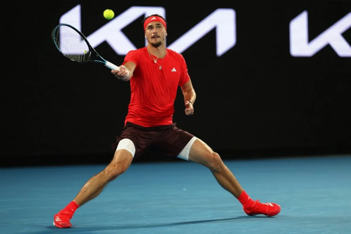 Germany's Alexander Zverev hits a shot against France's Lucas Pouille during their men's singles match on day one of the Australian Open tennis tournament in Melbourne on January 12, 2025.  Adrian DENNIS / AFP