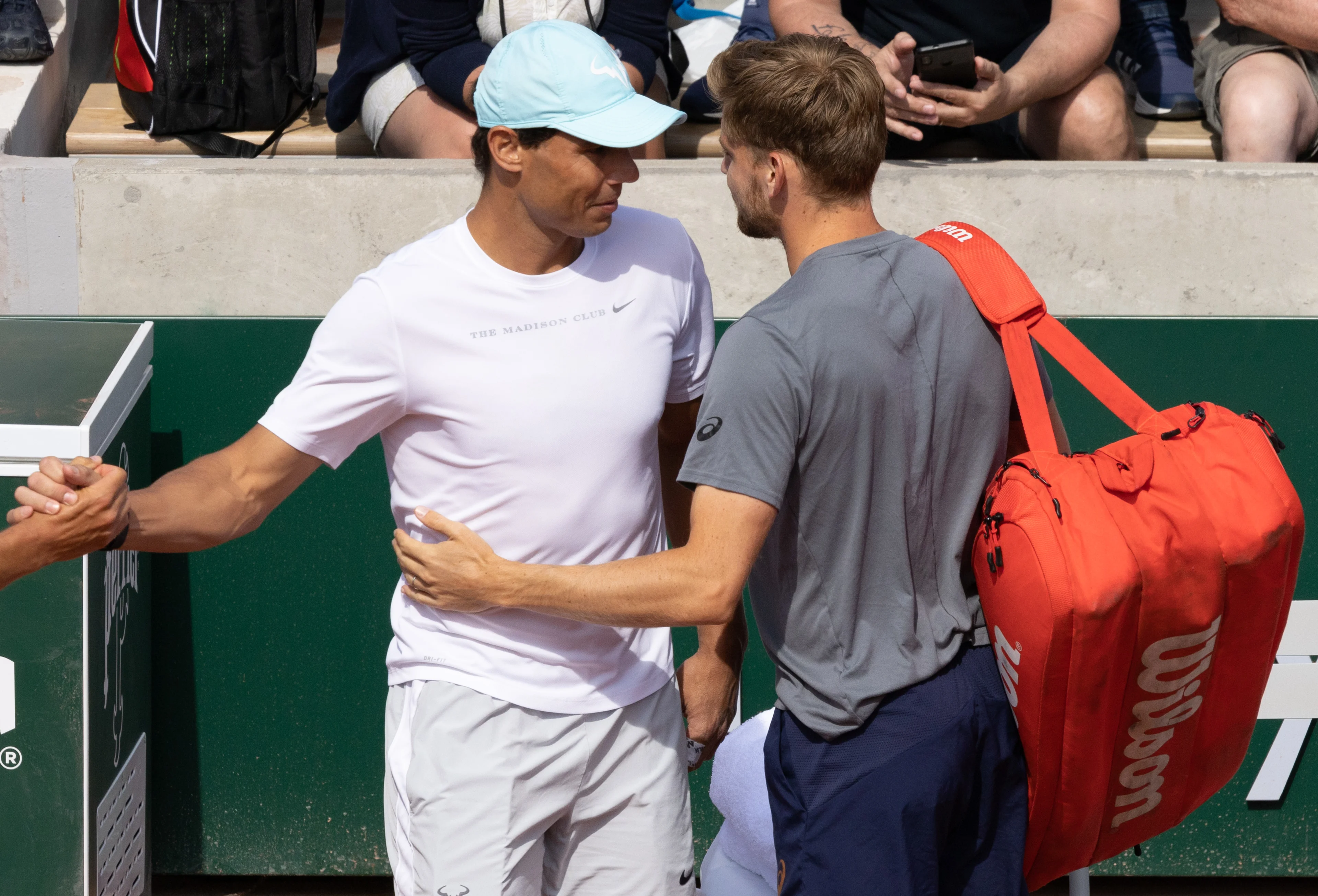 Spanish Rafael Nadal talks with Belgian David Goffin after a training session ahead of the Roland Garros French Open tennis tournament, in Paris, France, Saturday 21 May 2022. This year's tournament takes place from 22 May to 5 June. BELGA PHOTO BENOIT DOPPAGNE