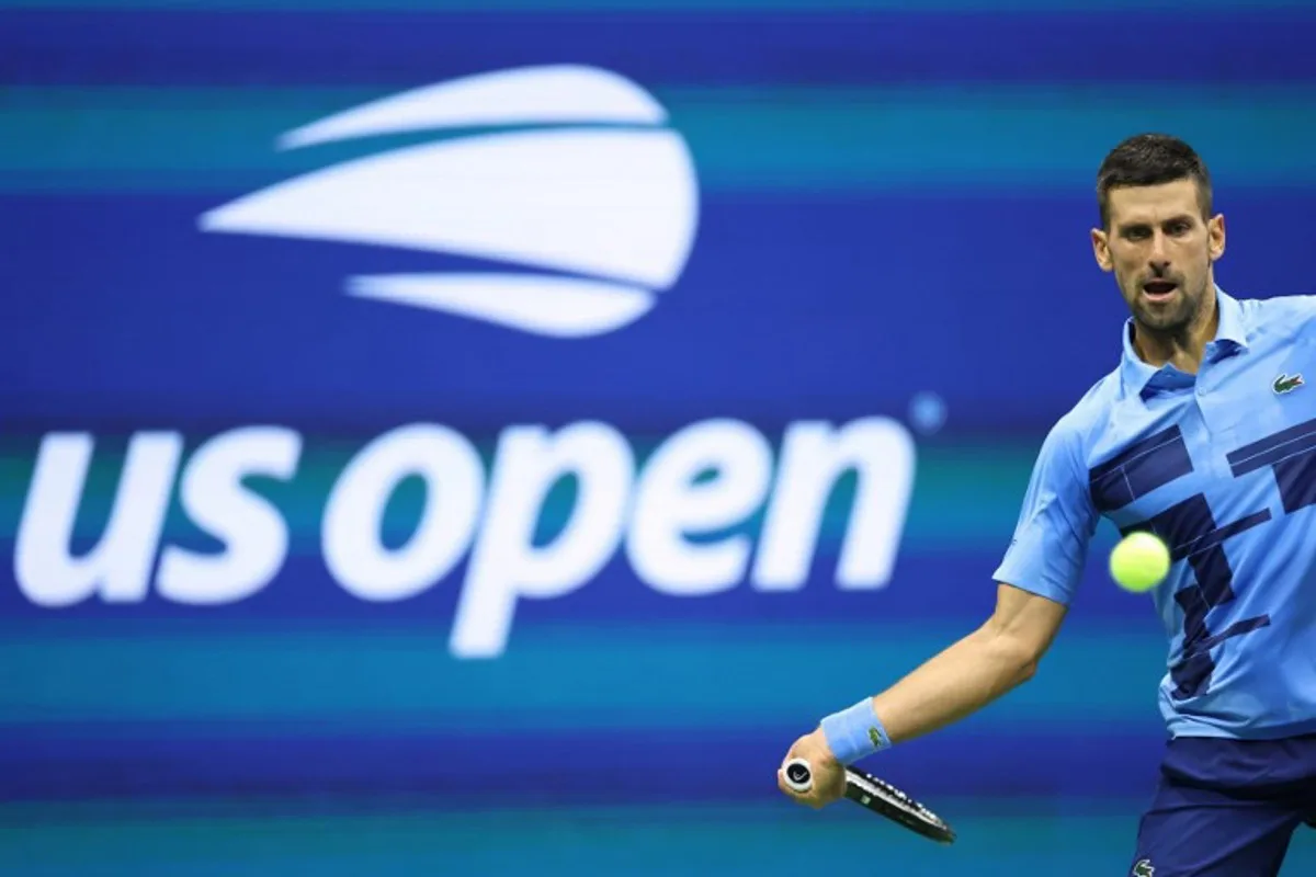 Serbia's Novak Djokovic returns the ball to Moldova's Radu Albot during their men's singles first round tennis match on day one of the US Open tennis tournament at the USTA Billie Jean King National Tennis Center in New York City, on August 26, 2024. CHARLY TRIBALLEAU / AFP