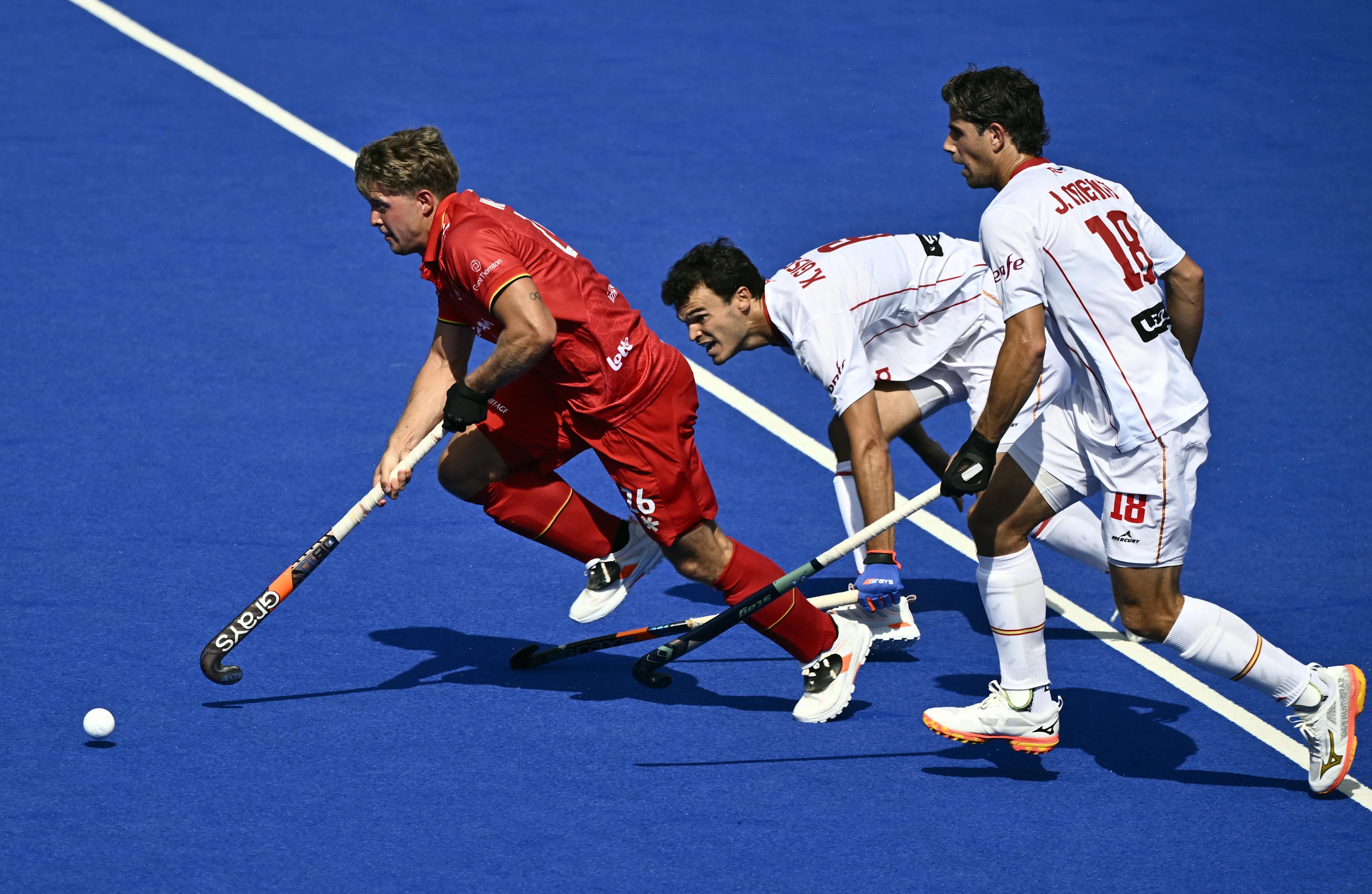 Belgium's Victor Wegnez and Spanish Joaquin Menini pictured in action during a hockey game between Spain and the Belgian national team Red Lions, match 3/3 in the pool stage of the 2025 men's European championships, Tuesday 12 August 2025 in Monchengladbach, Germany. BELGA PHOTO ERIC LALMAND