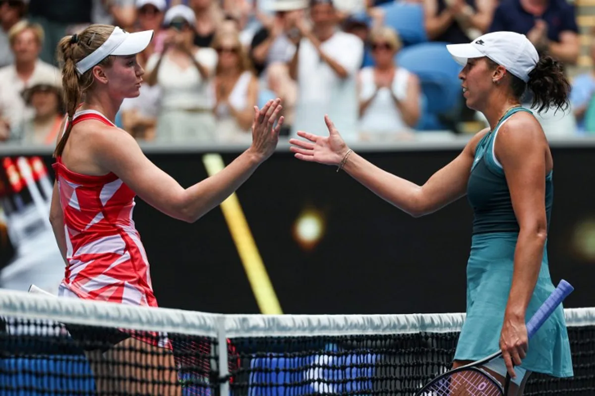 USA's Madison Keys (R) greets Kazakhstan's Elena Rybakina (L) after her victory in their women's singles match on day nine of the Australian Open tennis tournament in Melbourne on January 20, 2025.  Adrian Dennis / AFP