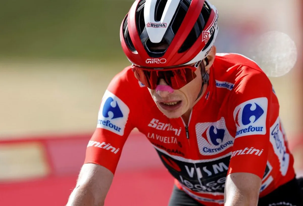 Overall leader team Visma-Lease a bike's Danish rider Jonas Vingegaard is pictured after winning the 20th stage of the Vuelta a Espana 2025, a 156 km race between Robledo de Chavela and Bola del Mundo, near Navacerrada, on September 13, 2025. Oscar DEL POZO / AFP