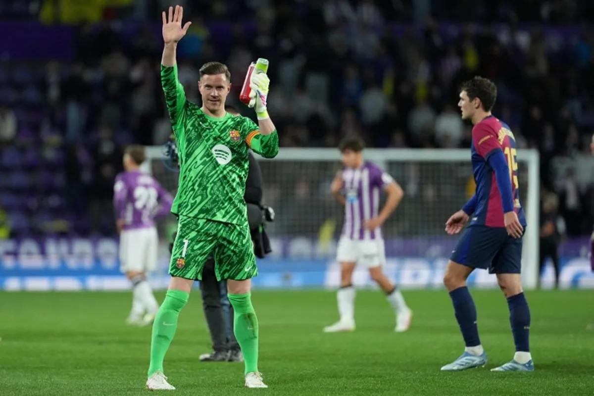 Barcelona's German goalkeeper #01 Marc-Andre Ter Stegen celebrates at the end of the Spanish league football match between Real Valladolid FC and FC Barcelona at the Jose Zorrilla stadium in Valladolid on May 3, 2025.  Cesar Manso / AFP
