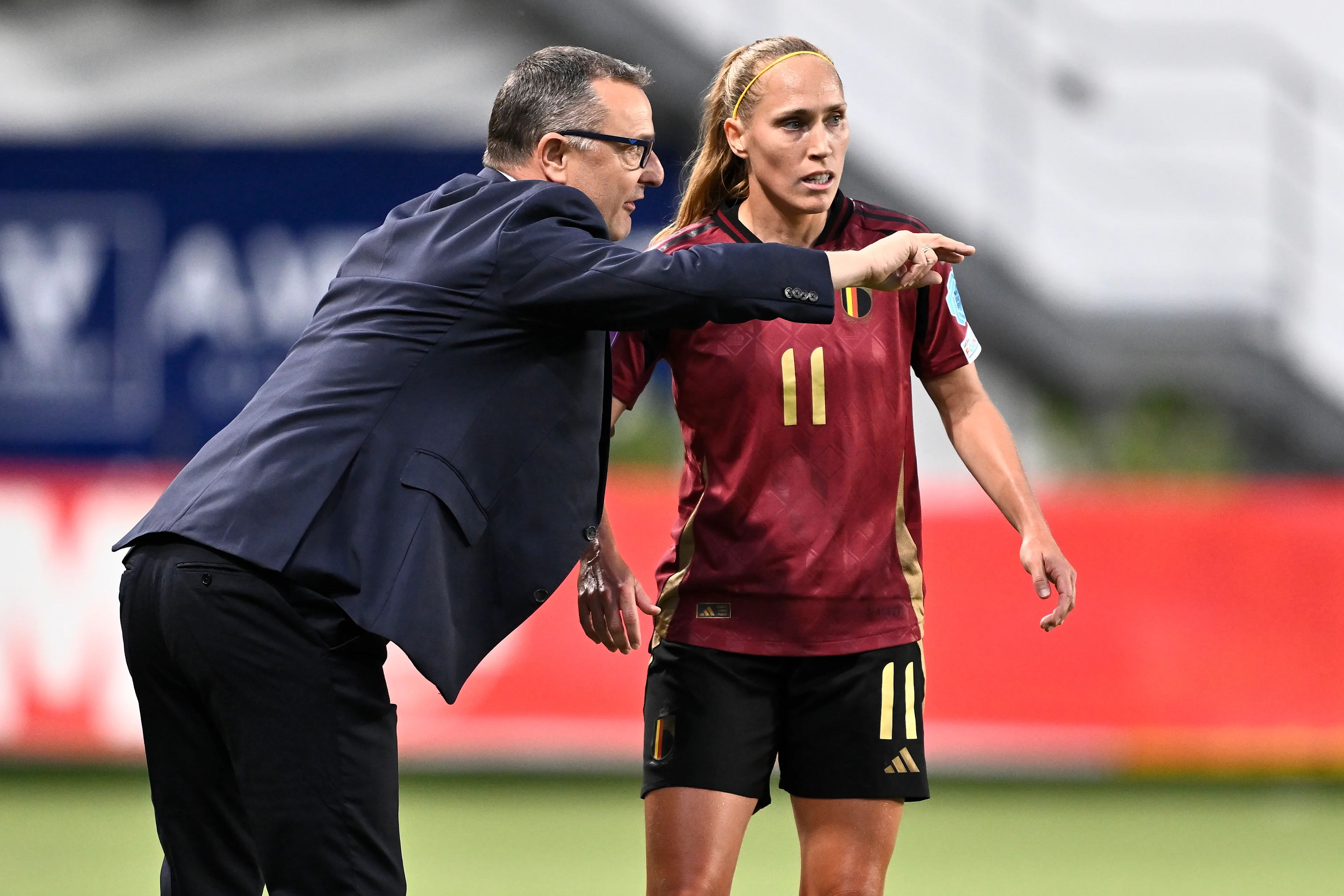 Belgium's head coach Ives Serneels and Belgium's Janice Cayman pictured during a soccer game between Belgium's national women's team the Red Flames and Denmark, on Friday 12 July 2024 in Sint Truiden, match 5/6 of the qualifications of the 2025 European Championships. BELGA PHOTO JOHAN EYCKENS