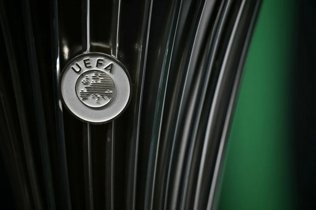 This photograph shows the UEFA logo displayed on the UEFA Conference League Cup ahead of the 2025-2026 UEFA Conference League round of 16, quarter-final and semi-final draw at the House of European Football in Nyon, western Switzerland on February 27, 2026.  Harold CUNNINGHAM / AFP