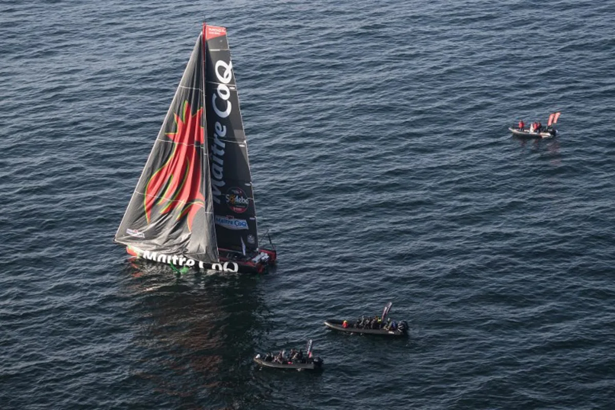 French skipper Yannick Bestaven sails his Imoca 60 monohull "Maitre Coq V" after the start of the 10th edition of the Vendee Globe around the world monohull solo sailing race, off the coast of Les Sables-d'Olonne, western France, on November 10, 2024.  Loic VENANCE / AFP