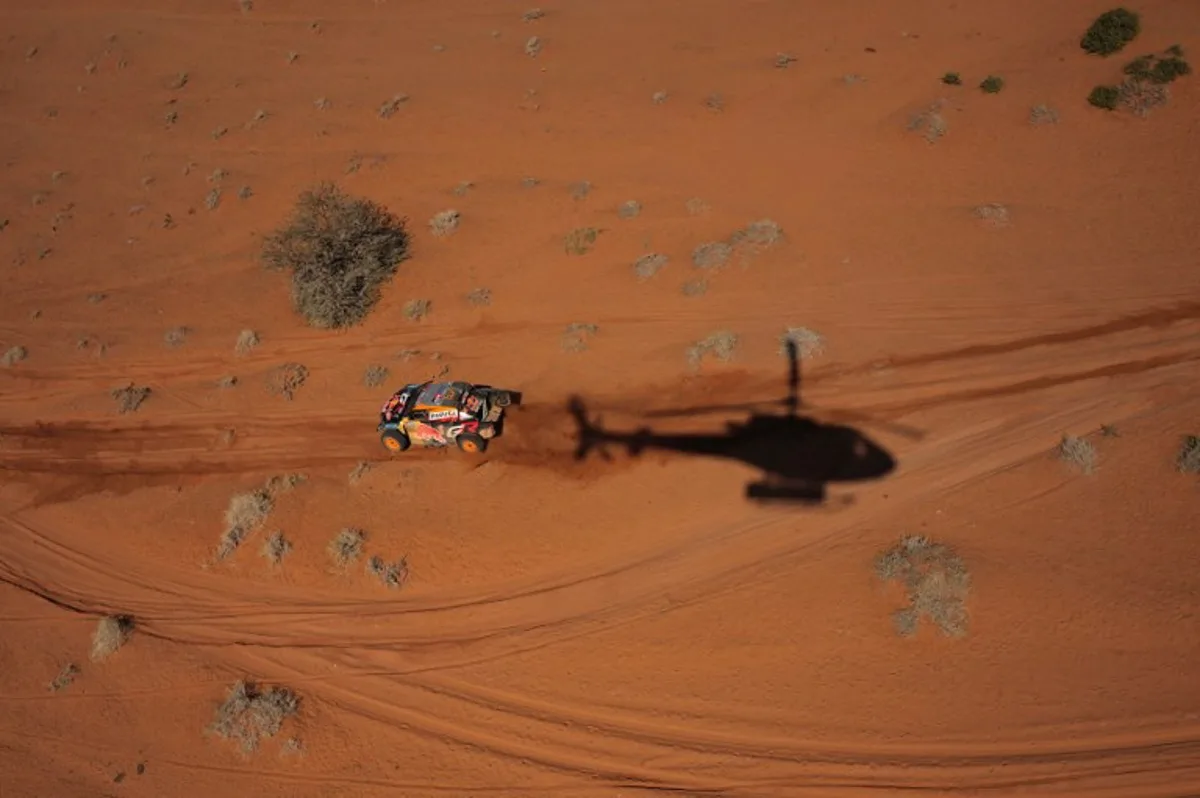 Toyota Gazoo Racing's Brazilian driver Lucas Moraes and Spanish navigator Armand Monleon compete during stage 4 of the Dakar Rally 2025 between Al Henakiyak and Alula, on January 8, 2025.  Valery HACHE / AFP