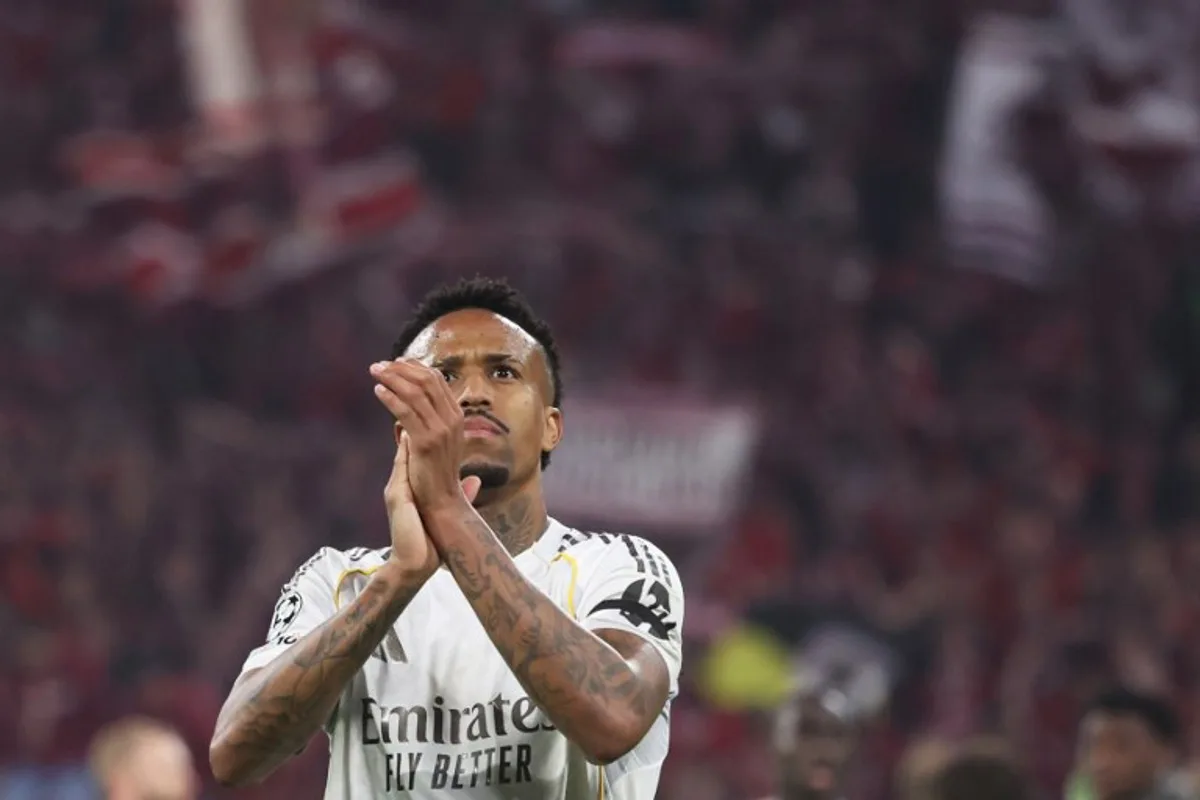 Real Madrid's Brazilian defender #03 Eder Militao greets the fans after the end of the UEFA Champions League quarter-final second leg football match between FC Bayern Munich and Real Madrid in Munich, southern Germany, on April 15, 2026.  Karl-Josef HILDENBRAND / AFP