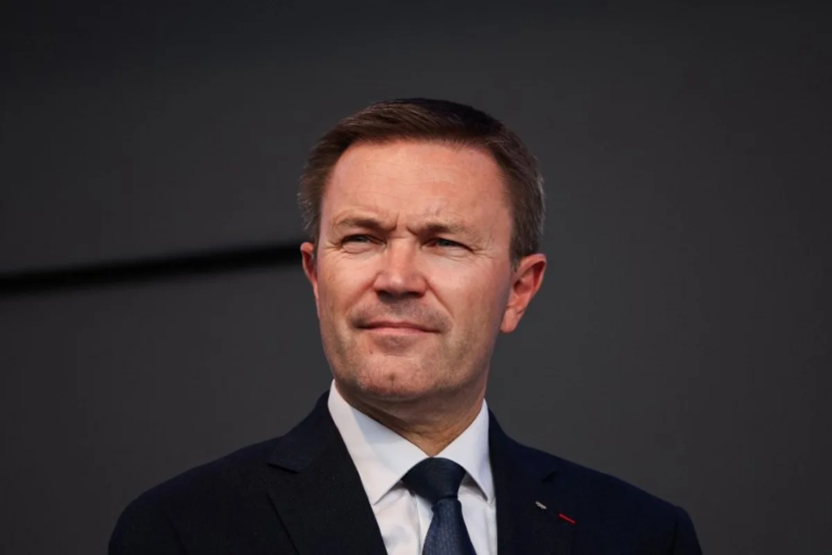 UCI President David Lappartient attends the medal ceremony following the men's Elite road race cycling event during the UCI 2025 Road World Championships, in Kigali, on September 28, 2025.  Anne-Christine POUJOULAT / AFP