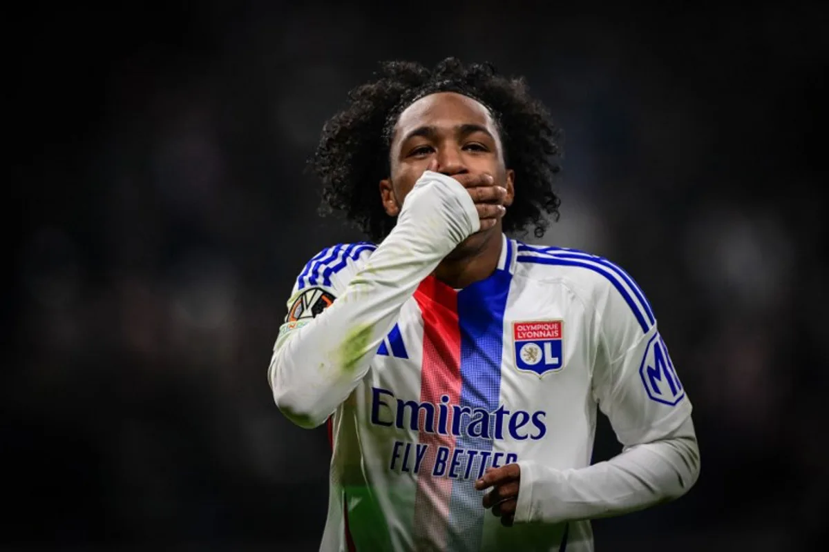 Lyon's Belgian forward #11 Malick Fofana celebrates scoring his team's second goal during the UEFA Europa League, league phase day 6, football match between Olympique Lyonnais (OL) and Eintracht Frankfurt at the Groupama Stadium in Decines-Charpieu, central-eastern France, on December 12, 2024.  OLIVIER CHASSIGNOLE / AFP