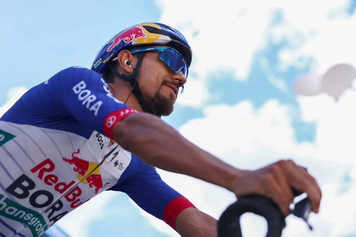 Red Bull - Bora - Hansgrohe's Colombian rider Daniel Felipe Martinez Poveda reacts ahead of the start of the 5th stage of the Tour Auvergne-Rhone-Alpes cycling race (formerly known as the Criterium du Dauphine), 195,8km between Saint-Chamond and Villars-les-Dombes, central France, on June 11, 2026.  Anne-Christine POUJOULAT / AFP