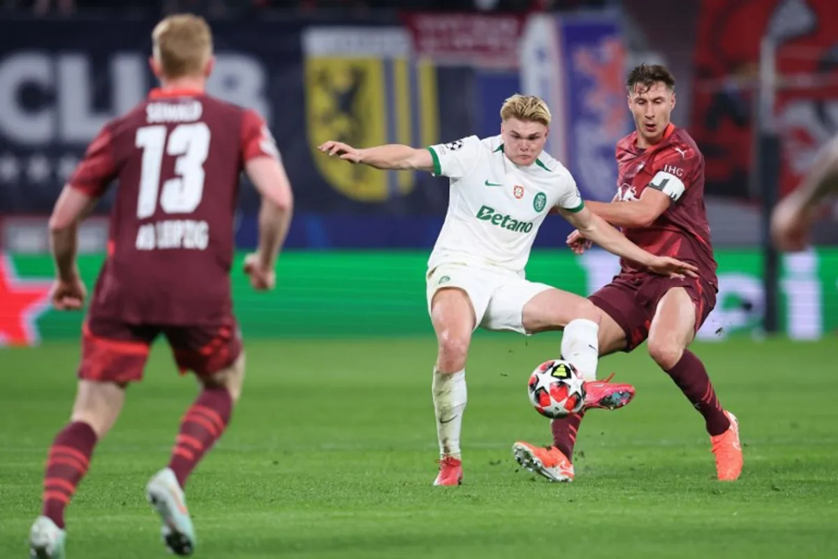 Leipzig's Hungarian defender #04 Willi Orban (R) and Sporting's Danish forward #19 Conrad Harder vie for the ball during the UEFA Champions League football match between RB Leipzig and Sporting CP in Leipzig, eastern Germany on January 22, 2025.  Ronny HARTMANN / AFP