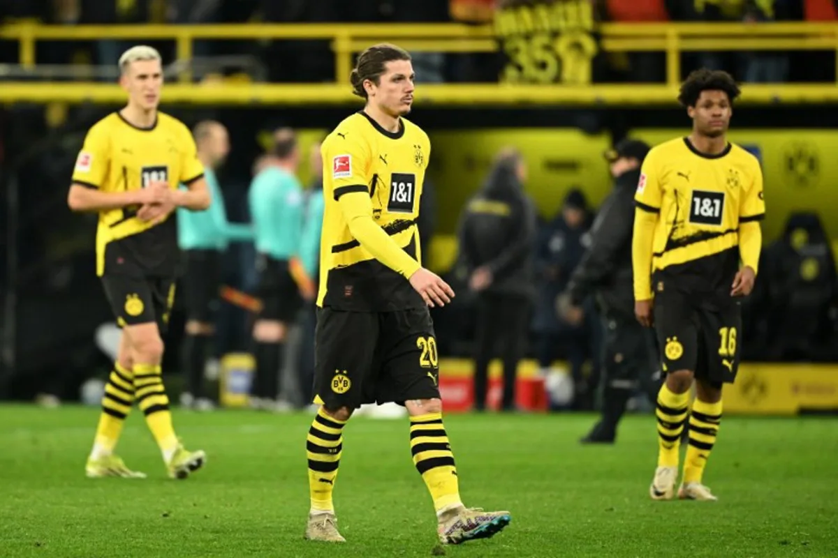 (LtoR) Dortmund's German defender #04 Nico Schlotterbeck, Dortmund's Austrian midfielder #20 Marcel Sabitzer and Dortmund's Belgian forward #16 Julien Duranville react at the end of the German first division Bundesliga football match between BVB Borussia Dortmund and TSG 1899 Hoffenheim in Dortmund, western Germany, on February 25, 2024.  INA FASSBENDER / AFP