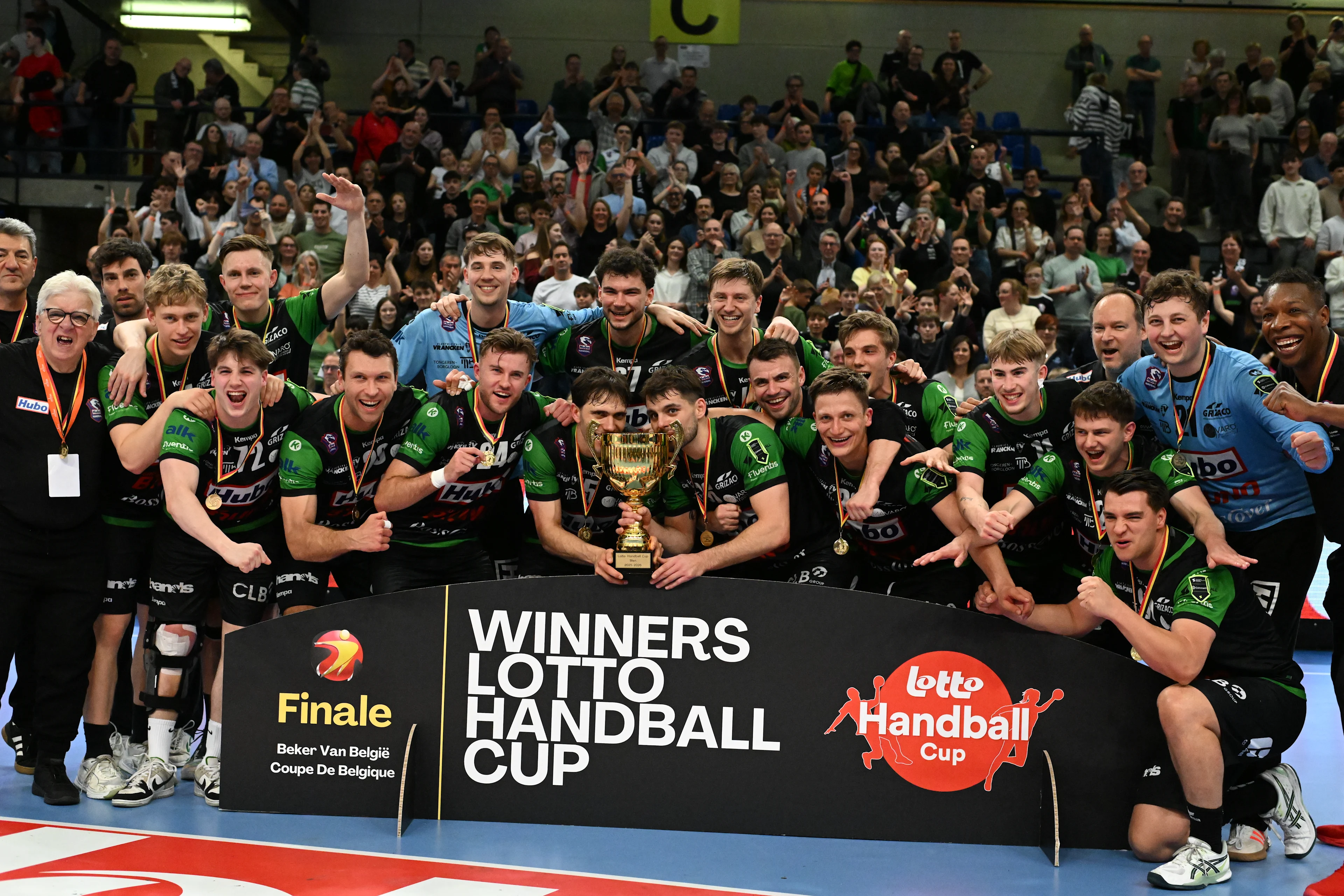 Hubo Handbal's players celebrate after winning a handball game between Achilles Bocholt and HUBO Handbal, Saturday 04 April 2026, in Hasselt, the men's final of the Belgian handball cup. BELGA PHOTO JILL DELSAUX