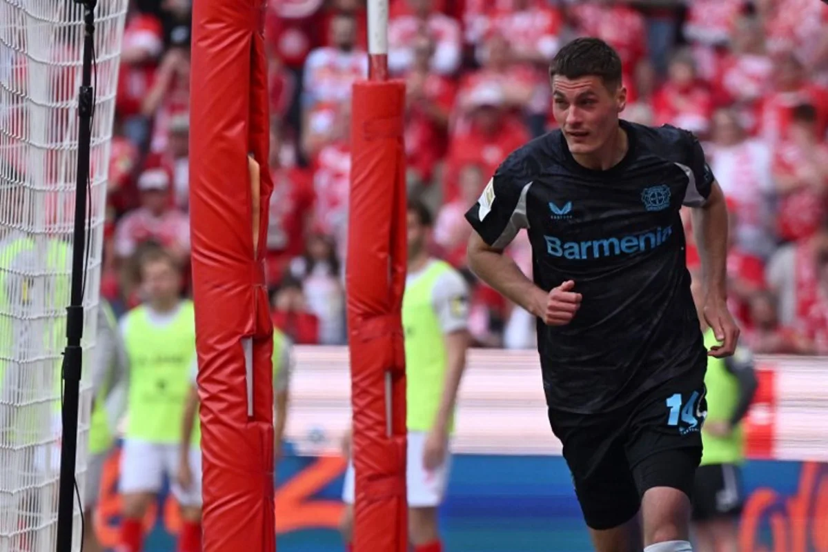 Bayer Leverkusen's Czech forward #14 Patrik Schick celebrates after scoring his team's second goal during the German first division Bundesliga football match between Mainz 05 and Bayer Leverkusen in Mainz, western Germany, on May 17, 2025. Kirill KUDRYAVTSEV / AFP