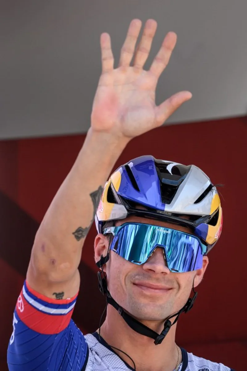 Red Bull-BORA-hansgrohe's Slovenian rider Primoz Roglic waves during the team presentation of the second stage of the Men's Tour of Switzerland (Tour de Suisse) cycling race in Locarno, Switzerland, on June 18, 2026. Fabrice COFFRINI / AFP
