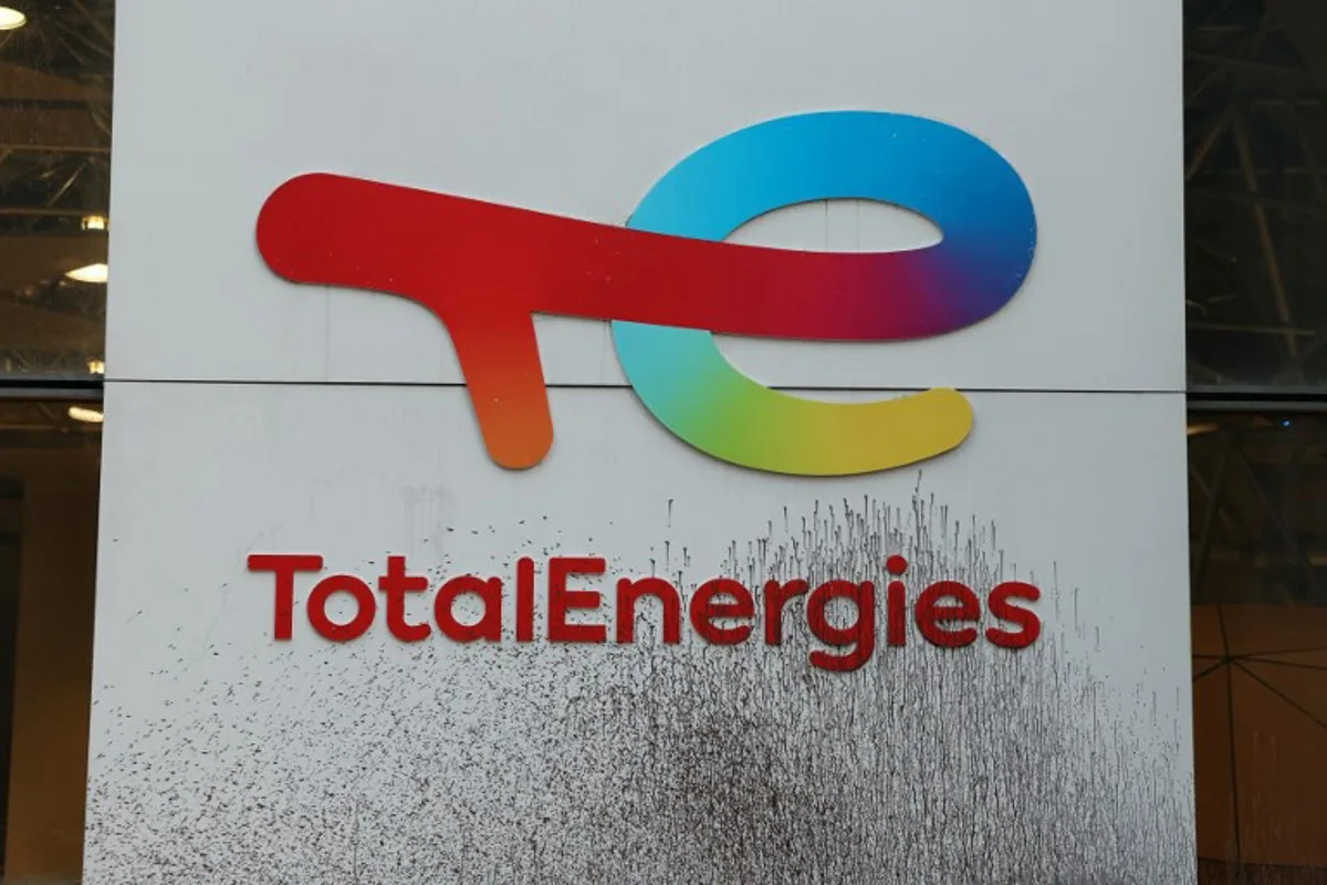 The logo of TotalEnergies is seen smeared during a Greenpeace protest against polluters in front of TotalEnergies' headquarters at La Defense business district, west of Paris, on November 18, 2024, as a G20 meeting of the world's biggest economies starts in Rio de Janeiro. Alain JOCARD / AFP