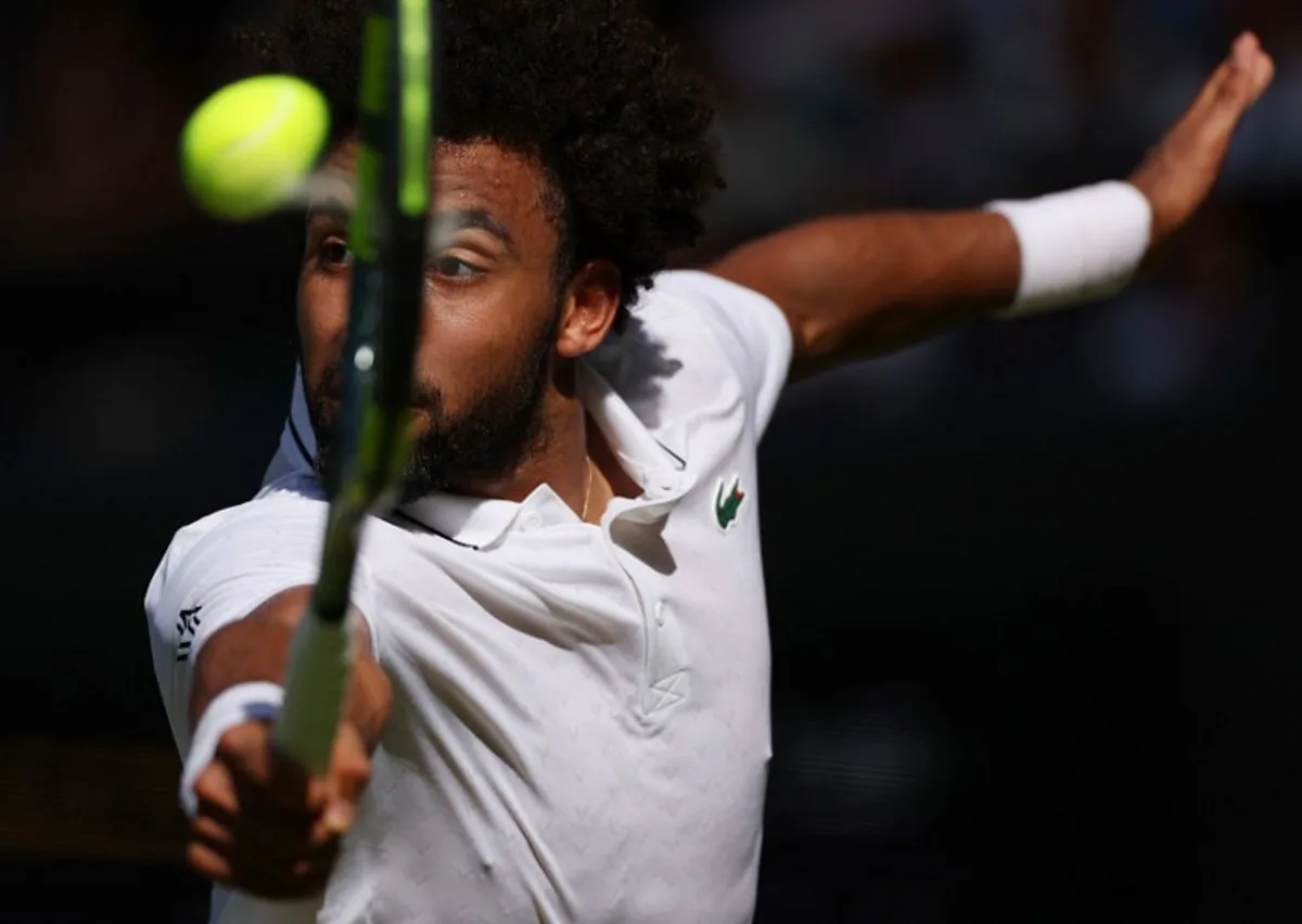 France's Arthur Fils returns against Italy's Matteo Berrettini during their men's singles second round tennis match on the fourth day of the 2026 Wimbledon Championships at The All England Lawn Tennis and Croquet Club in Wimbledon, southwest London, on July 2, 2026.  Adrian Dennis / AFP