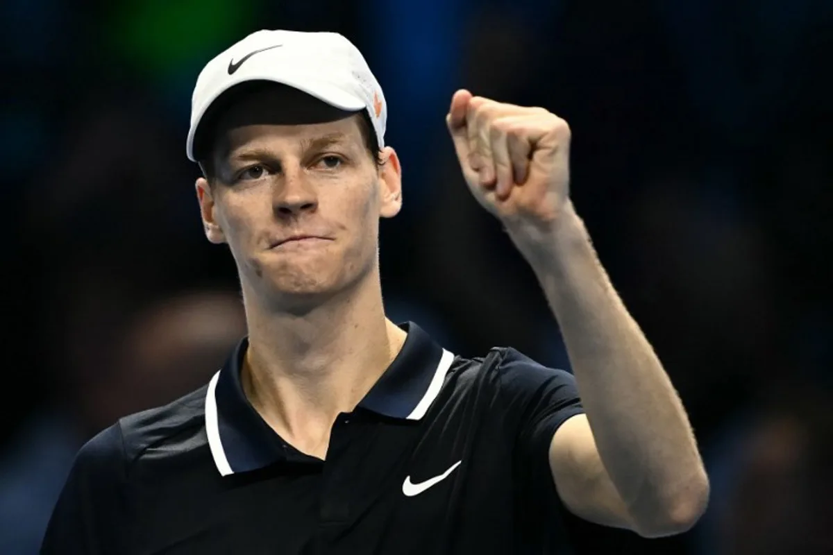 Italy's Jannik Sinner celebrates after winning his match against USA's Taylor Fritz at the ATP Finals tennis tournament in Turin on November 12, 2024.  Marco BERTORELLO / AFP