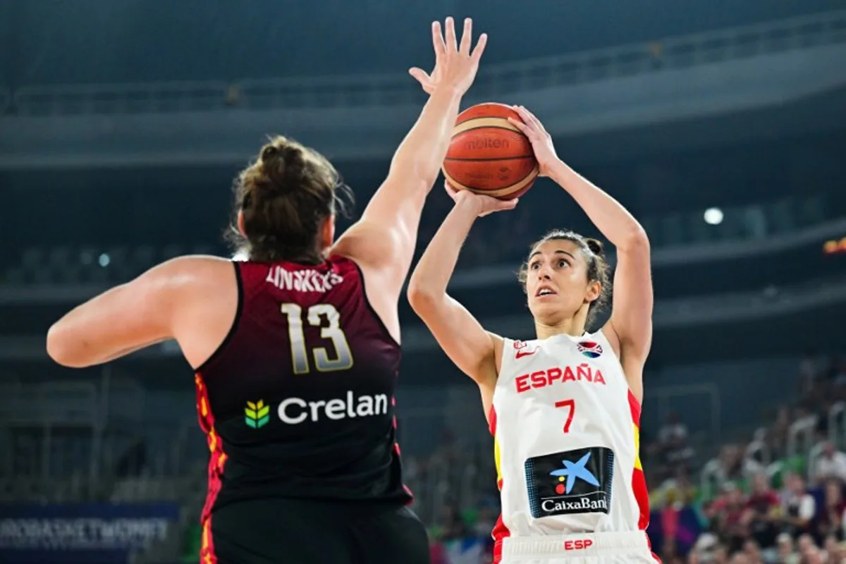 Spain's small forward Alba Torrens (R) fights for the ball with Belgium's center Kyara Linskens (L) during the FIBA Women's Eurobasket 2023 final basketball match between Spain and Belgium at the Arena Stozice in Ljubljana, Slovenia, on June 25, 2023. Jure Makovec / AFP