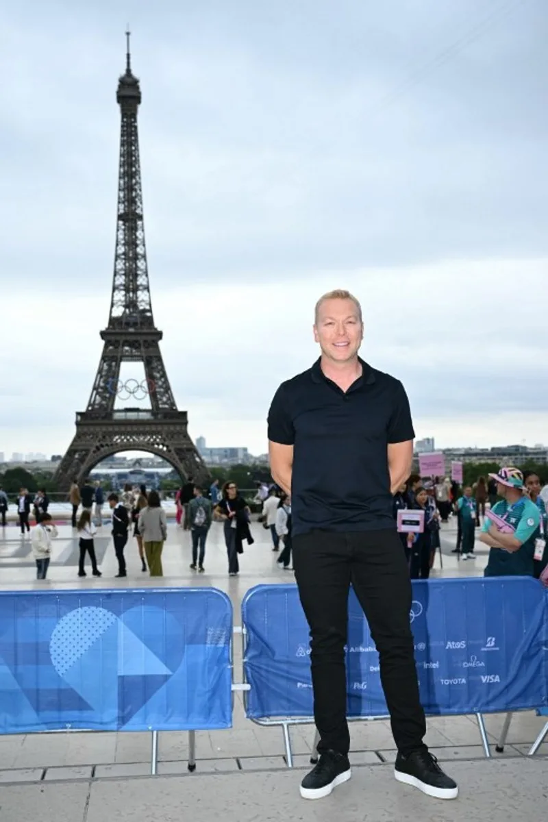 Former British track cyclist Chris Hoy arrives ahead of the opening ceremony of the Paris 2024 Olympic Games in Paris on July 26, 2024, as the Eiffel Tower is seen in the background.  Jonathan NACKSTRAND / AFP