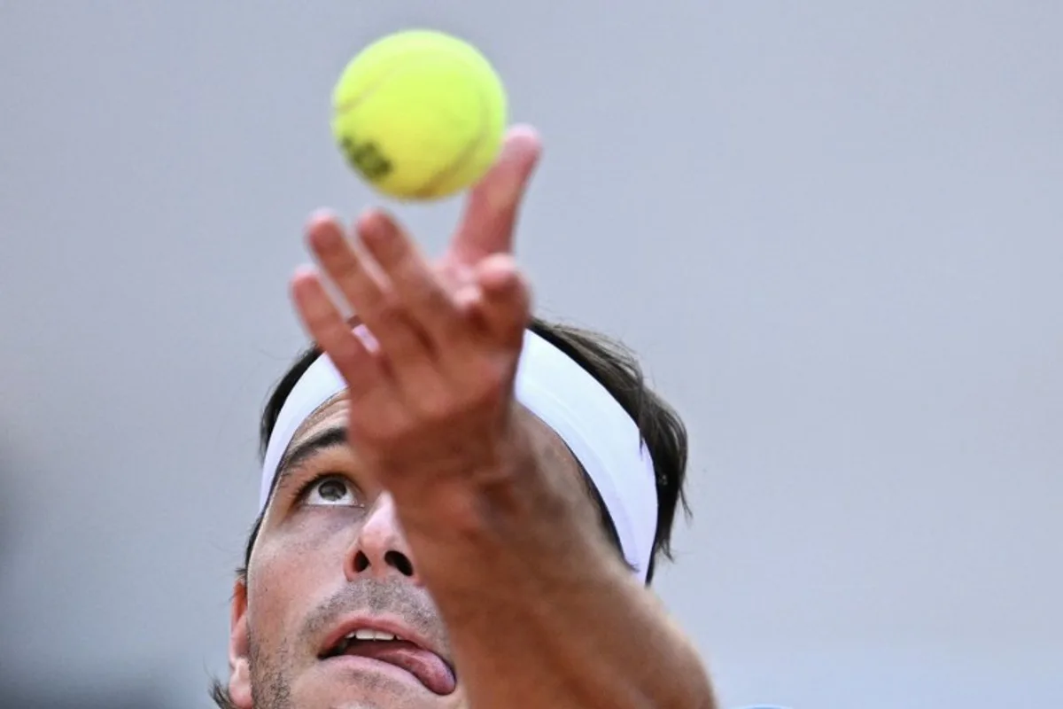 US Taylor Fritz pserves to US Nishesh Basavareddy during their men's singles match on day 1 of the French Open tennis tournament on Court Suzanne-Lenglen at the Roland-Garros Complex in Paris on May 24, 2026. JULIEN DE ROSA / AFP