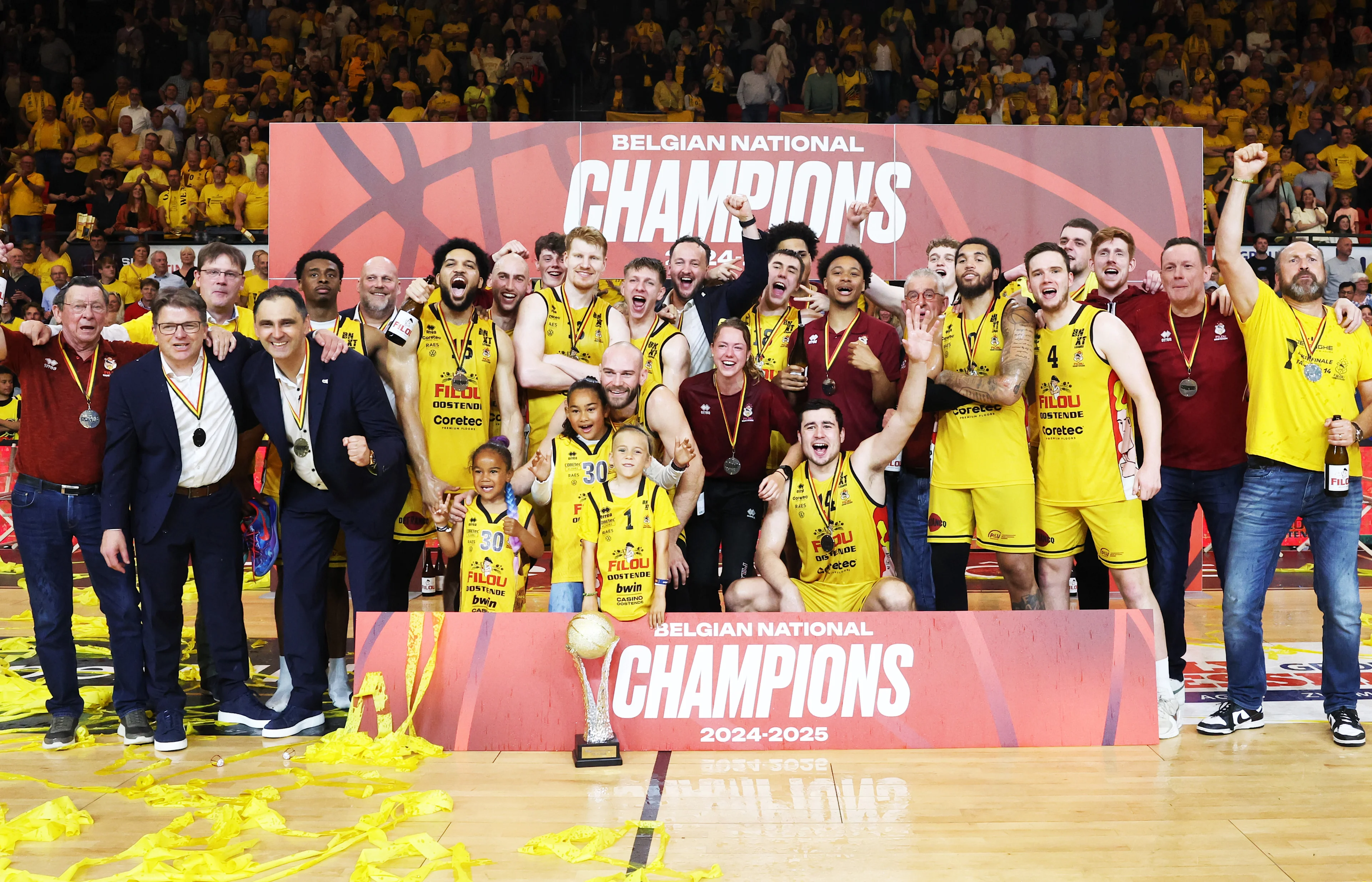 Oostende's players and staff celebrate after winning the Belgian BNXT championship, Saturday 07 June 2025 in Oostende. BC Oostende defeats Kangoeroes Mechelen 100-76 in the fourth game of the best-of-5 finals in the playoffs of the 'BNXT League' Belgian/ Dutch first division basket championship. BELGA PHOTO KURT DESPLENTER