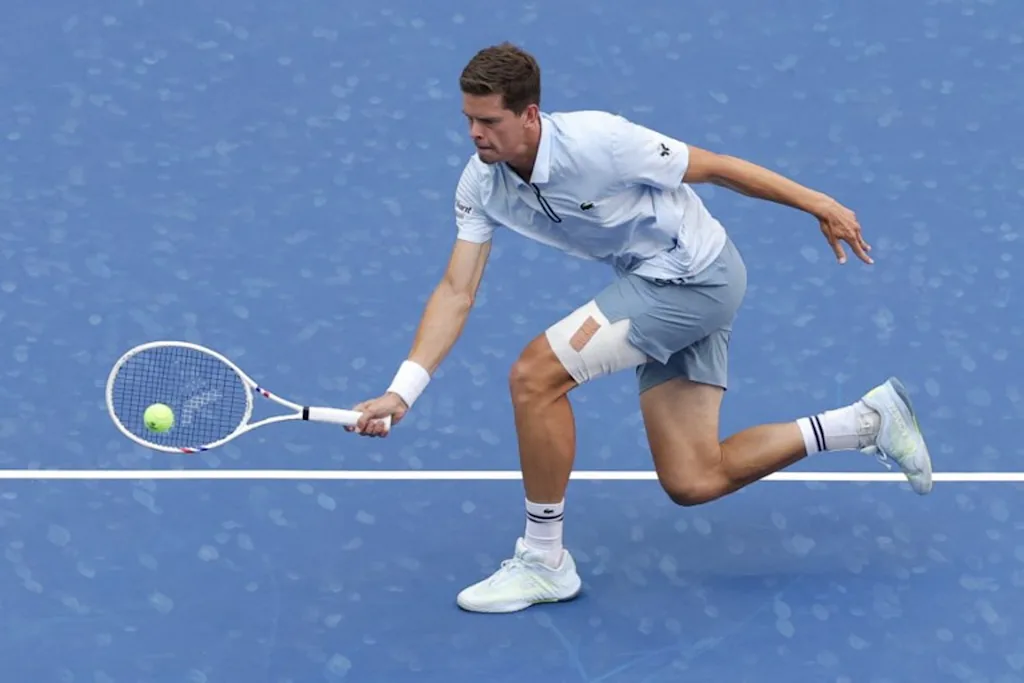 Belgium's Alexander Blockx hits a return to Argentina's Francisco Cerundolo in their men's singles round of 16 tennis match on day nine of the US Open tennis tournament at the USTA Billie Jean King National Tennis Center in New York on September 7, 2026. KENA BETANCUR / AFP