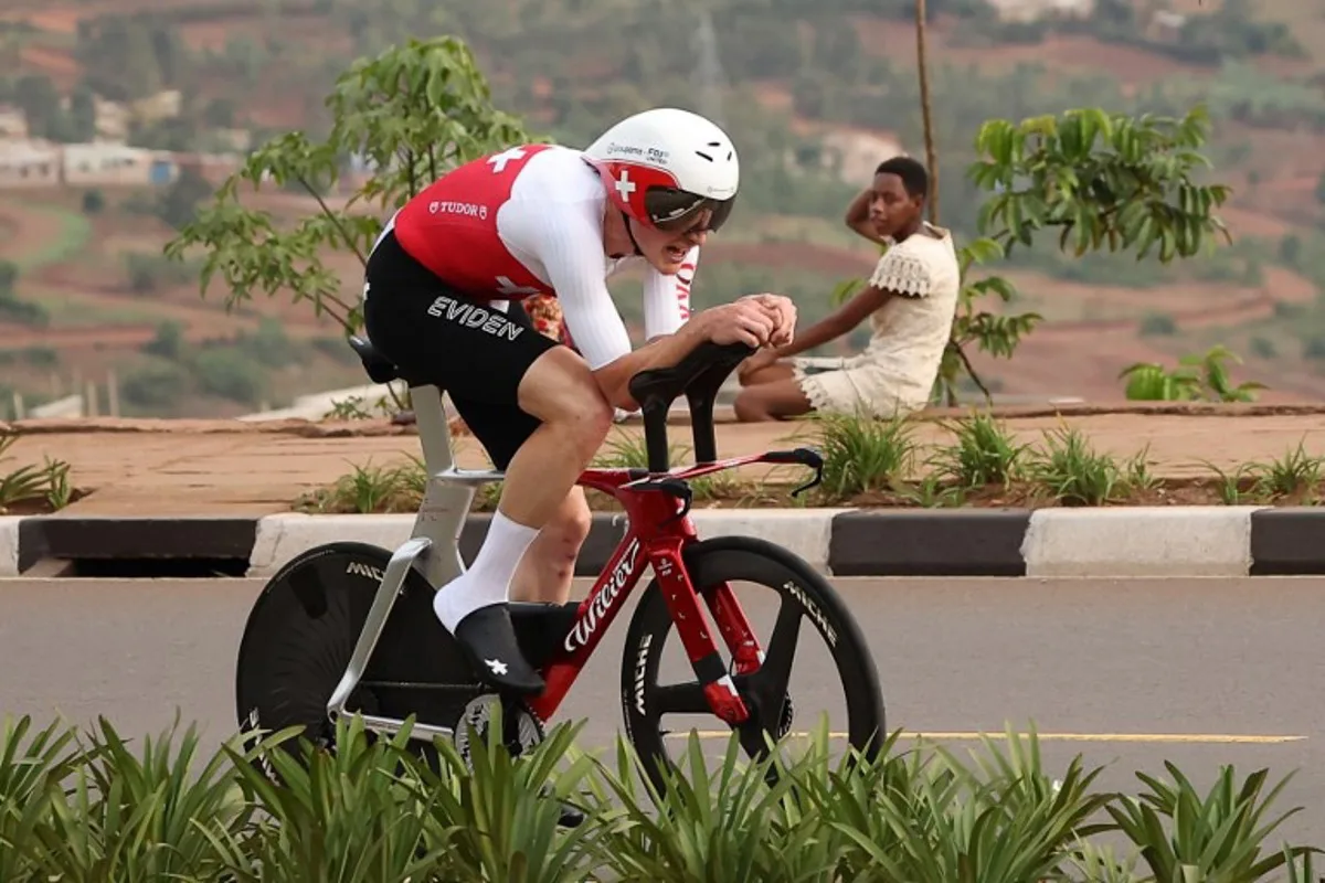 Swiss rider Stefan Kung competes in the men's Elite Individual Time Trial cycling event during the UCI 2025 Road World Championships, in Kigali, on September 21, 2025. Anne-Christine POUJOULAT / AFP