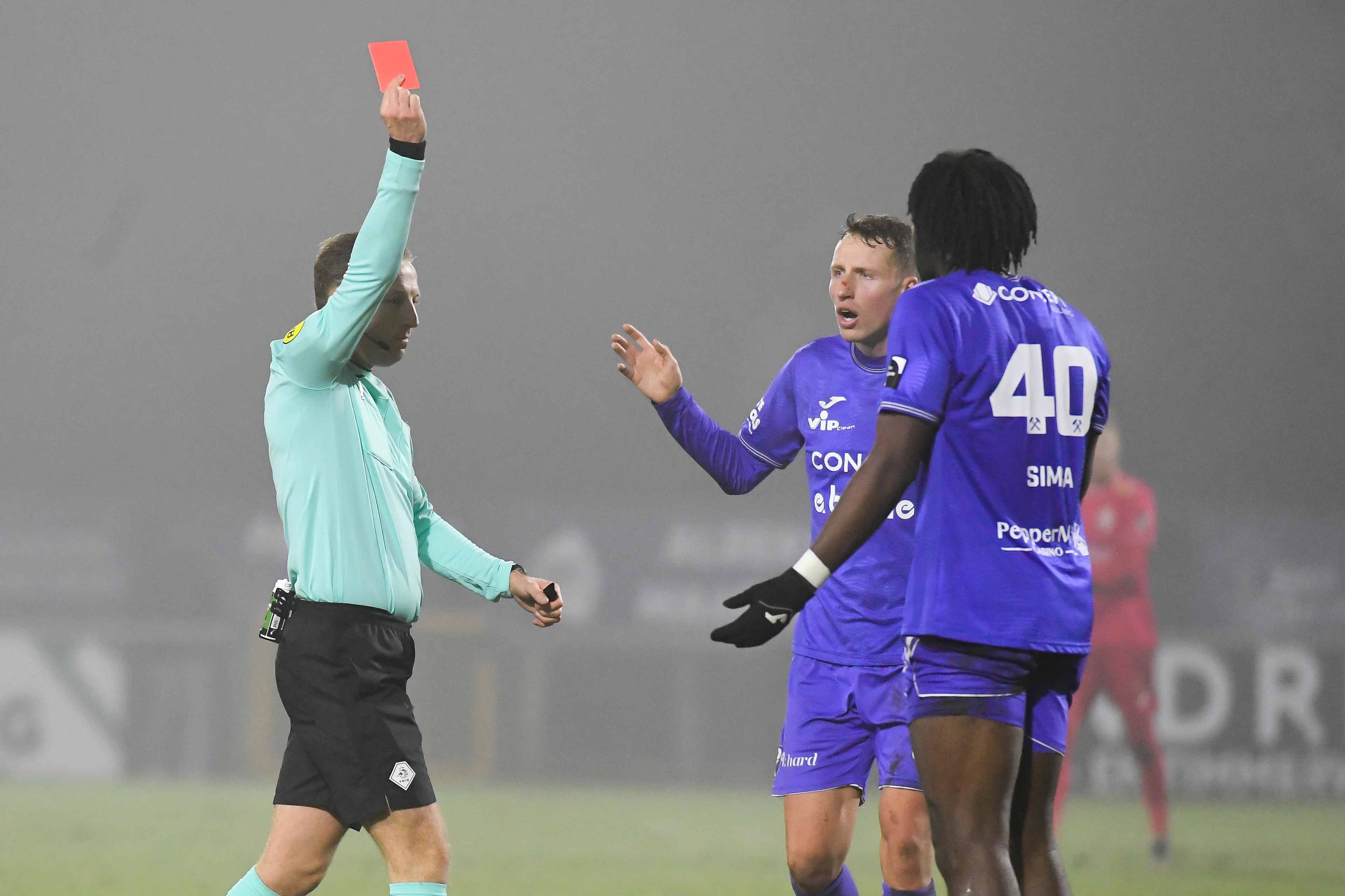 Patro Eisden's William Simba receives a red card from the referee during a soccer match between Patro Eisden Maasmechelen and KSC Lokeren-Temse, Friday 17 January 2025 in Maasmechelen, on day 18 of the 2024-2025 'Challenger Pro League' second division of the Belgian championship. BELGA PHOTO JILL DELSAUX