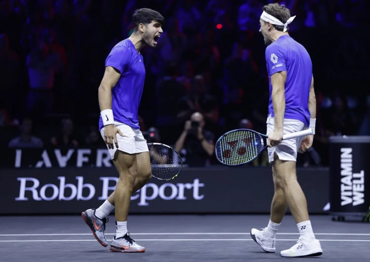 Spain's Carlos Alcaraz of Team Europe and Norway's Casper Ruud of Team Europe celebrate winning at the end of their 2024 Laver Cup men's doubles tennis match against USA's Frances Tiafoe of Team World and USA's Ben Shelton of Team World, in Berlin on September 22, 2024.  Odd ANDERSEN / AFP