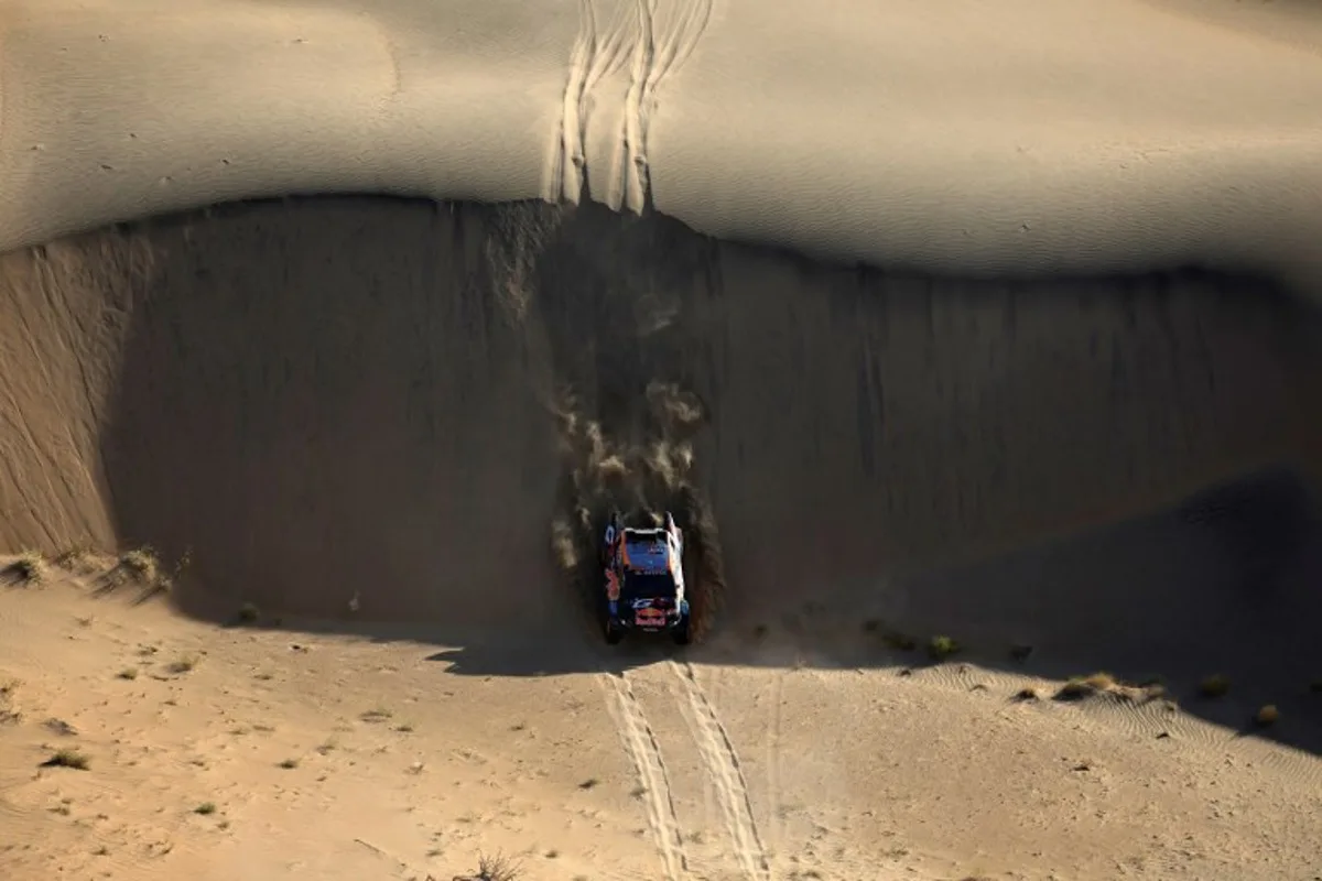 Brazilian driver Lucas Moraes steers his car assisted by co-driver Armand Monleon during stage 2B of the 47th Dakar Rally between Bisha and Bisha, on January 6, 2025.  Valery HACHE / AFP