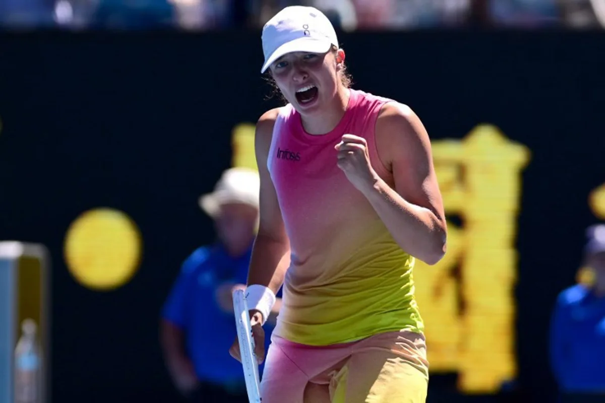 Poland's Iga Swiatek celebrates victory over USA's Emma Navarro after their women's singles quarter-final match on day eleven of the Australian Open tennis tournament in Melbourne on January 22, 2025.  Yuichi YAMAZAKI / AFP