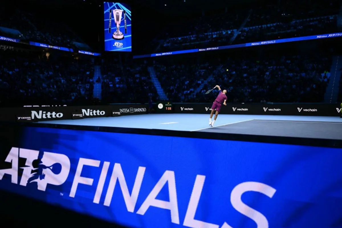 Norway's Casper Ruud serves to Germany's Alexander Zverev during their match at the ATP Finals tennis tournament in Turin on November 13, 2024.  Marco BERTORELLO / AFP