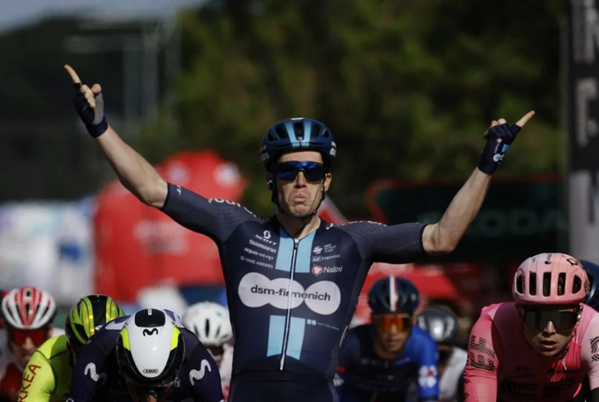 Team Dsm's Italian rider Alberto Dainese celebrates winning the stage 19 of the 2023 La Vuelta cycling tour of Spain, a 177,1 km race between La Baneza and Iscar on September 15, 2023. Oscar DEL POZO / AFP