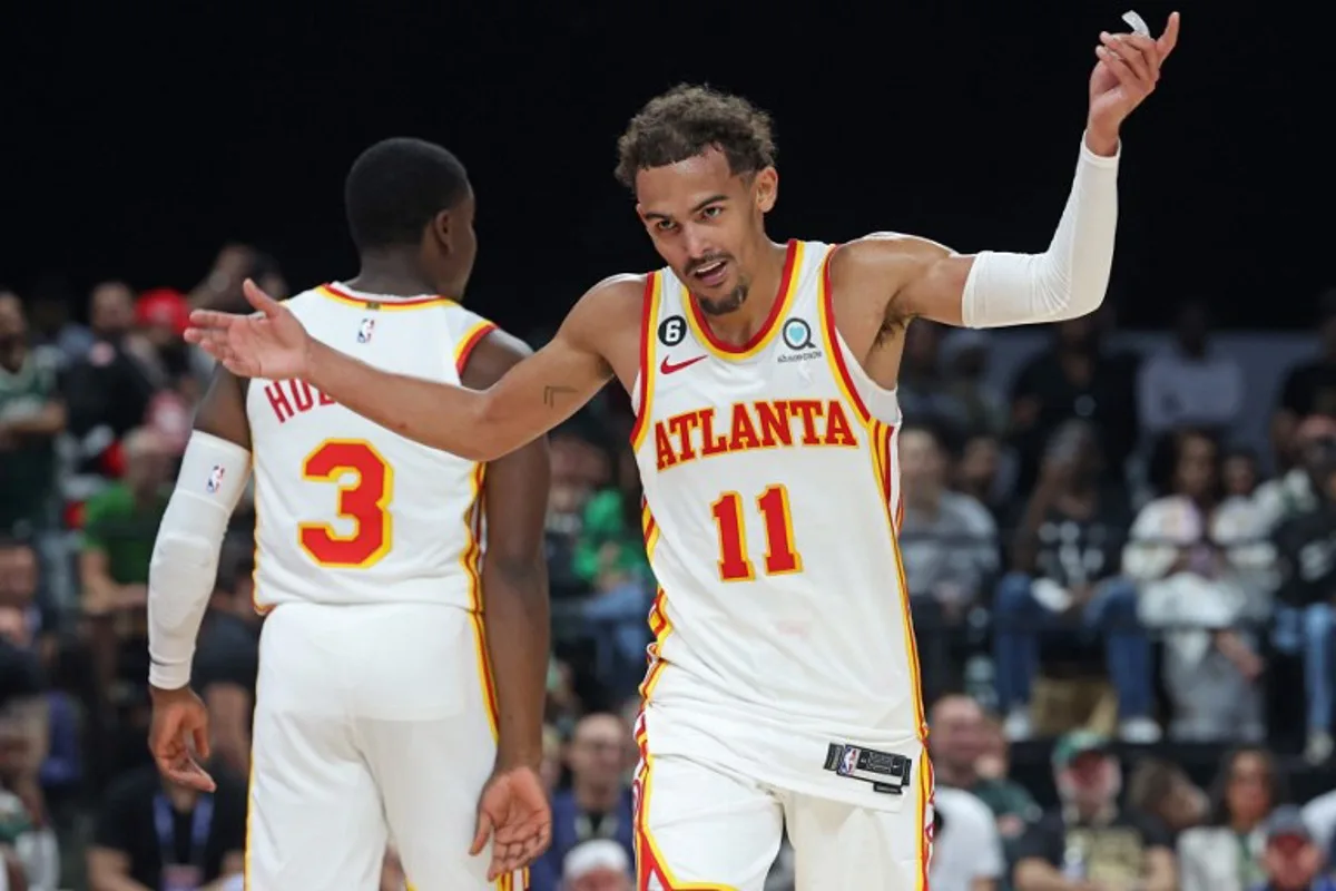 Atlanta Hawks' guard Trae Young reacts during the NBA pre-season basketball match between the Milwaukee Bucks and the Atlanta Hawks at the Etihad Arena on Yas Island in Abu Dhabi, on October 8, 2022.  Giuseppe CACACE / AFP