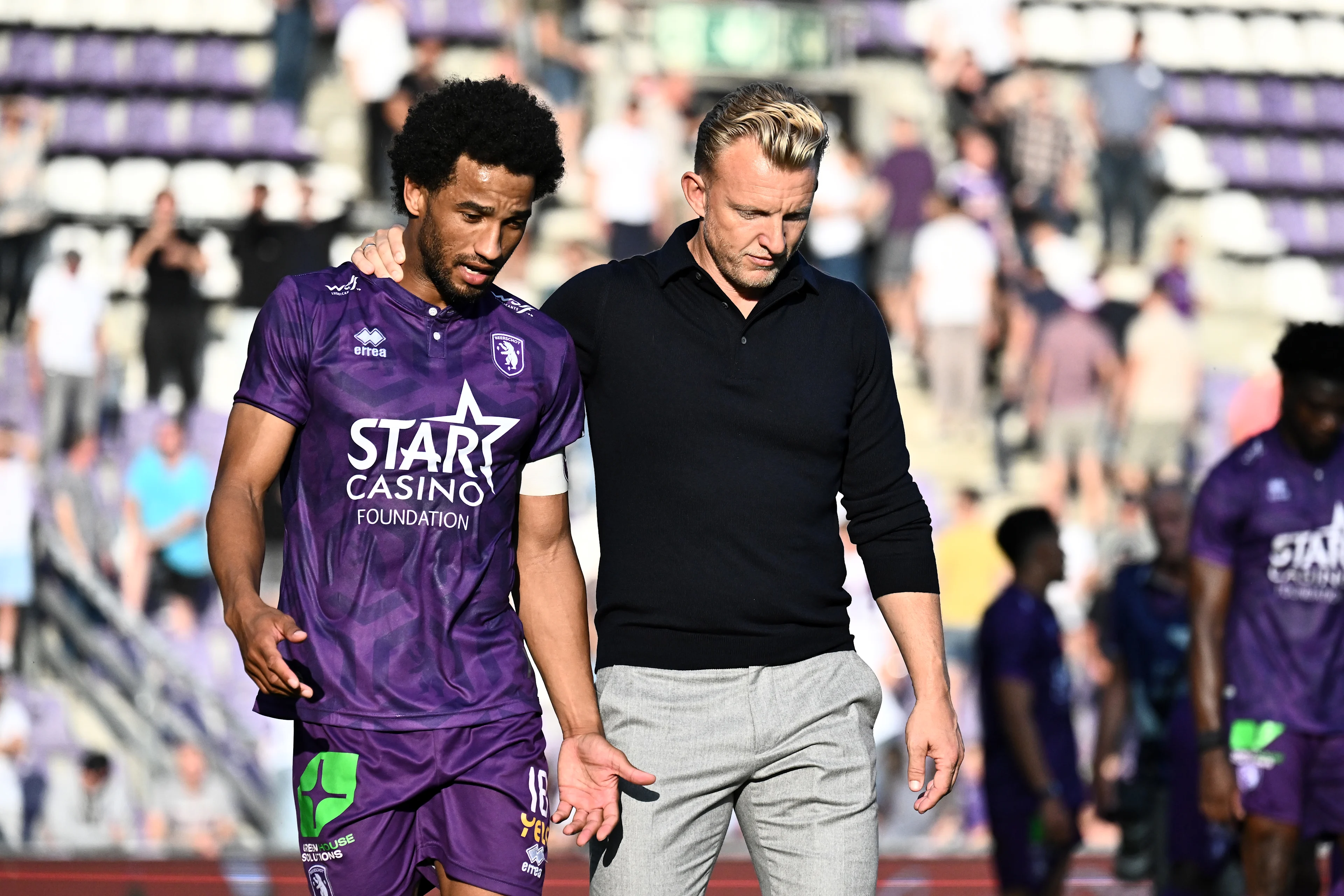 Beerschot's Ryan Sanusi and Beerschot's head coach Dirk Kuyt pictured after a soccer match between Beerschot VA and Sint-Truiden VV, in Antwerp, on the eight day of the 2024-2025 season of the 'Jupiler Pro League' first division of the Belgian championship, Saturday 21 September 2024. BELGA PHOTO MAARTEN STRAETEMANS